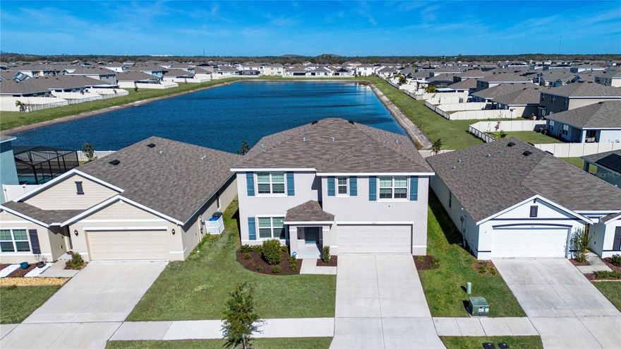 Welcome to this beautifully upgraded home located at 5456 Logan Cave Ave in Wimauma, offering the perfect blend of comfort, style, and Florida outdoor living. Porcelain tile flows throughout the main living areas, while wall-to-wall carpet adds warmth to the bedrooms and flex room. The kitchen is thoughtfully appointed with granite countertops, Whirlpool stainless steel appliances, and center island that can seat up to 4 people, making it ideal for both everyday living and entertaining.
Additional upgrades include added recessed can lighting in every room, blinds on all windows, vinyl insulated Low-E windows, and impact shutters for peace of mind. The upstairs laundry room adds convenience, and the home boasts abundant closet space throughout. Gas appliances, MyQ smart garage door access, and a full home alarm system complete the package.
Step outside to your private backyard oasis featuring a large pavered patio with screened lanai, a stunning inground pool and spa with aggregate finish (up to 7 feet deep), electric heat pump, and child safety fence. Enjoy serene views of the pool overlooking the neighborhood lake/pond—perfect for relaxing or entertaining year-round.
Located in a desirable community offering a clubhouse, pool with Olympic swim lanes, and environmentally conscious solar-powered street lamps, this home delivers both lifestyle and value. Don’t miss your opportunity to own this exceptional property—schedule your private showing today.
