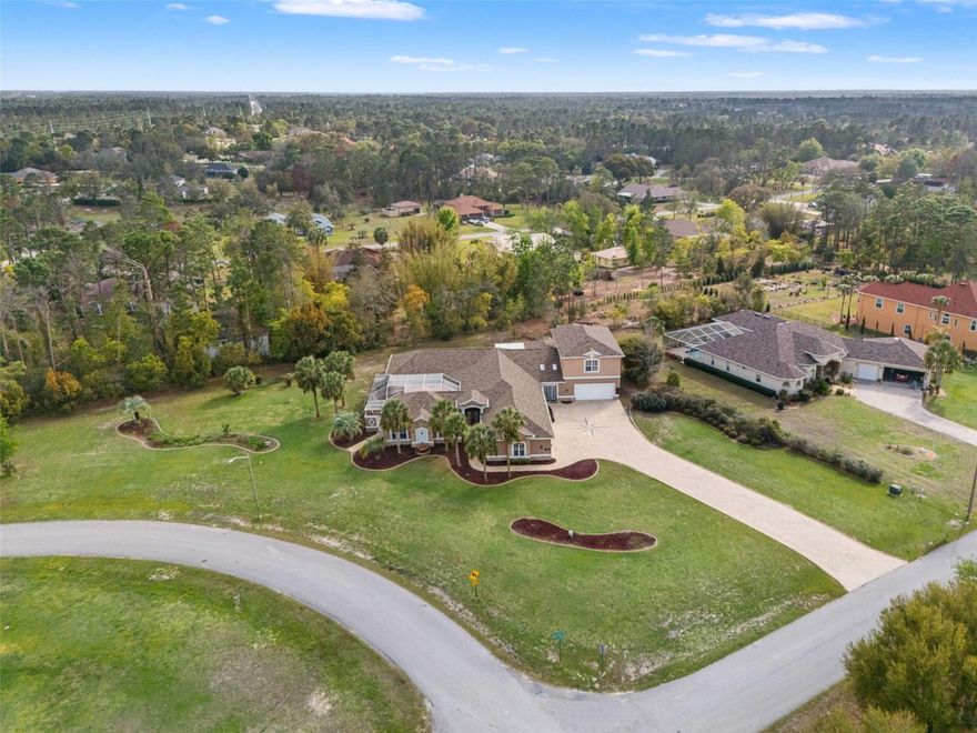 A remarkably EXCEPTIONAL estate! Welcome to 11296 Warm Wind Way, where no stone goes unturned in this fully custom home. Spanning over 5,500 sqft and situated on just under 1.5 acres, this home offers an abundance of space. With updates from top to bottom, this home features a newer roof (2025), newer A/C units (2018, 2021, 2024) including UV filtration systems, and so much more! As you pull up to the home, you’ll be greeted by a grand entrance, including a spacious six-car garage, perfect for a home gym or for storing all of your toys. From the moment you step inside, you’re welcomed by a large foyer featuring polished porcelain marble flooring, leading you right into the living and dining area. The beautifully crafted open kitchen features top of the line appliances, gorgeous finishes, and a double oven. As you walk through the home, you’ll notice elegant and unique features accented by crown molding throughout, and tastefully placed tray ceilings, with some rooms featuring triple tray ceilings that make you feel like you’re in a museum. The primary suite offers generously sized dual closets, along with an absolutely breathtaking bathroom featuring dual vanities, a large soaking tub, and a shower you’ll fall in love with. Now let’s head to the focal point of the home: the stunning resort-style saltwater cabana pool. This is where gatherings turn into unforgettable nights. With plenty of seating and space to entertain, a breathtaking waterfall, a spacious area to watch movies or games, and beautifully laid pavers, this outdoor space is truly one of a kind. The outdoor kitchen turns the backyard into the ultimate space for grilling, entertaining, and enjoying Florida living by the pool. This home also features a two bedroom, one bath guest suite, making it perfect for overnight guests or multi-generational living for large families. The expansive layout includes five generously sized bedrooms and five bathrooms, along with a dedicated office. Movie nights just got WAY bigger with a fully custom MOVIE THEATER in the home. Featuring a 150-inch screen, soundproofing throughout the room, and so much more, you’ll never want to leave! Right off the movie theater is where you’ll find your spacious office, which leads directly to your covered lanai, perfect for hanging outside, or getting work done and enjoying the beautiful weather. Now let’s head upstairs, where there’s even more room to entertain. This space is perfect to be used as a game room, second living room, or anything else you can imagine. With the second kitchen including a full bar, this area showcases another example of how accommodating this home is for entertaining. Want some fresh air? Step outside and enjoy the cool Florida breeze from your balcony, overlooking your spacious 1.49 acre estate and the beautiful weather Florida has to offer. This home is built to entertain and is centrally located near the Weeki Wachee River, shops, dining, and only an hour drive from Tampa, Clearwater and top rated beaches! This home will absolutely not last, call today to make it yours!