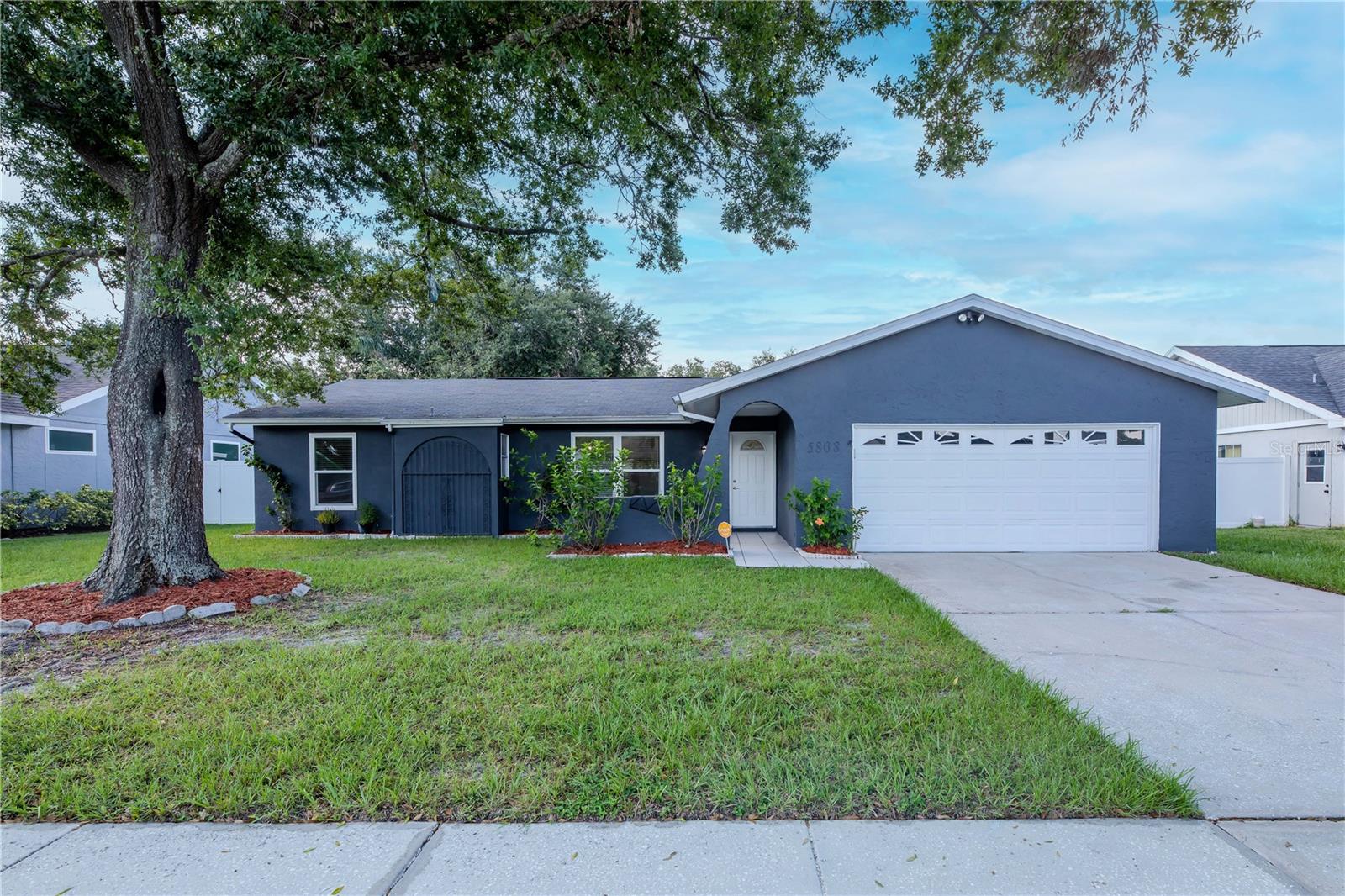 Don’t miss this incredible opportunity to own your dream home in the heart of Citrus Park and Carrollwood! This beautifully updated 3-bedroom, 2-bathroom residence with a 2-car garage is located in the highly desirable Mandarin Lakes subdivision, offering the perfect combination of suburban tranquility and city convenience. From the moment you arrive, you’ll notice the pride of ownership and thoughtful upgrades that make this home truly move-in ready.
With 1,662 sq. ft. of living space on a spacious 7,875 sq. ft. lot, this home provides plenty of room to enjoy both indoors and outdoors. Recent upgrades include a roof replaced in 2018 and fully paid-off solar panels, giving you substantial savings on your monthly electricity bills. Even better, this home has NO CDD fees and a very low HOA fee of only around $10 month, making it one of the most affordable and attractive options in the area.
Step inside and experience the inviting, open-concept layout designed for modern living. Elegant flooring flows seamlessly throughout the home, creating a cohesive and stylish look. The gourmet kitchen is a chef’s delight, featuring granite countertops, tall soft-close cabinets, and ample storage space. Whether you are preparing a quiet meal at home or entertaining friends and family, this kitchen is perfectly equipped to meet your needs.
The spacious living and dining areas open beautifully to the outdoors, where you’ll discover a true Florida oasis. A screened lanai offers the ideal spot to relax year-round, while the large fenced backyard is perfect for gatherings, barbecues, and outdoor fun. The yard is adorned with mature fruit trees, including mango, adding both charm and functionality to the space. It’s a private retreat where you can unwind, host celebrations, or simply enjoy watching pets play freely in the safety of your fenced yard.
This home’s location is unmatched. In addition, the property is just minutes away from Citrus Park Mall, a variety of dining options, shopping centers, and everyday conveniences. Commuters will appreciate the easy access to the Veterans Expressway, which makes getting around the Tampa Bay area effortless. You’re also only 20 minutes from Tampa International Airport, making travel a breeze. Nearby recreational destinations include Ed Radice Sports Complex, Carrollwood Village Park, Lake Rogers Park for camping, boating, and fishing, and local entertainment spots like Brewlands Bar & Billiards.
To give you even more peace of mind, this home comes with an American Home Shield “Complete” Home Warranty, one of the most comprehensive coverages available. The warranty protects all major systems, including air conditioning, plumbing, ductwork, electrical, and water heater. It also covers appliances such as the refrigerator, dishwasher, microwave, range, washer, and dryer, as well as additional items like ceiling fans, garage door opener, and exhaust fans. This ensures that your investment is well-protected from day one( more clarity with brochure AHS). With its combination of modern updates, low monthly costs, spacious lot, and unbeatable location, this home truly stands out in today’s market. Don’t miss your chance to call it yours—schedule your private tour today and experience the perfect balance of suburban peace and urban convenience! Call now to schedule property tour!