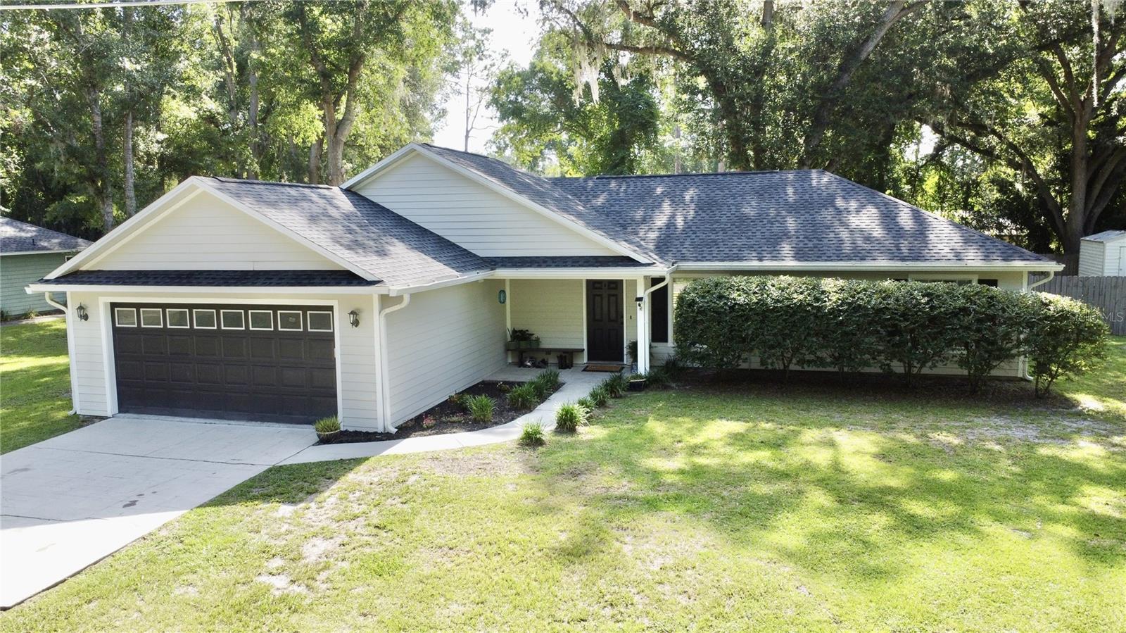 Welcome to this charming single-story home nestled in Lake City’s desirable Century Oak subdivision, with NO HOA! This beautifully maintained residence, built in 2006, offers 3 spacious bedrooms and 2 full baths with a split floor plan totaling 1,508 sq ft of heated & cooled, well-designed living space! The main area has vaulted ceilings with lots of light and windows that are complemented by updated LVP flooring. NO CARPET! The kitchen includes newer stainless steel appliances and deep double sinks! The roof and exterior paint are only 3 years old. There is a peaceful retreat for owners with a spacious bedroom with an en suite bath and a spacious walk-in closet. The home has gutters and a two car, attached garage with ample storage space and has convenient laundry hookups. The home is set on a generous 0.34-acre lot, high and dry not in a flood zone and is fully fenced and provides your own private green space for outdoor activities, gardening, or relaxing under shade trees. Just minutes from Lake City shops, restaurants, and top-rated schools with great proximity to interstates 10 & 75, positioning you well for commuting or traveling. You are also less than an hour away from world famous clear water springs, rivers & lakes for excellent recreational opportunities in beautiful North Florida! This move-in-ready gem blends a spacious open concept interior with terrific outdoor space in a conveniently located neighborhood. Call today to schedule your private showing before this one gets away!