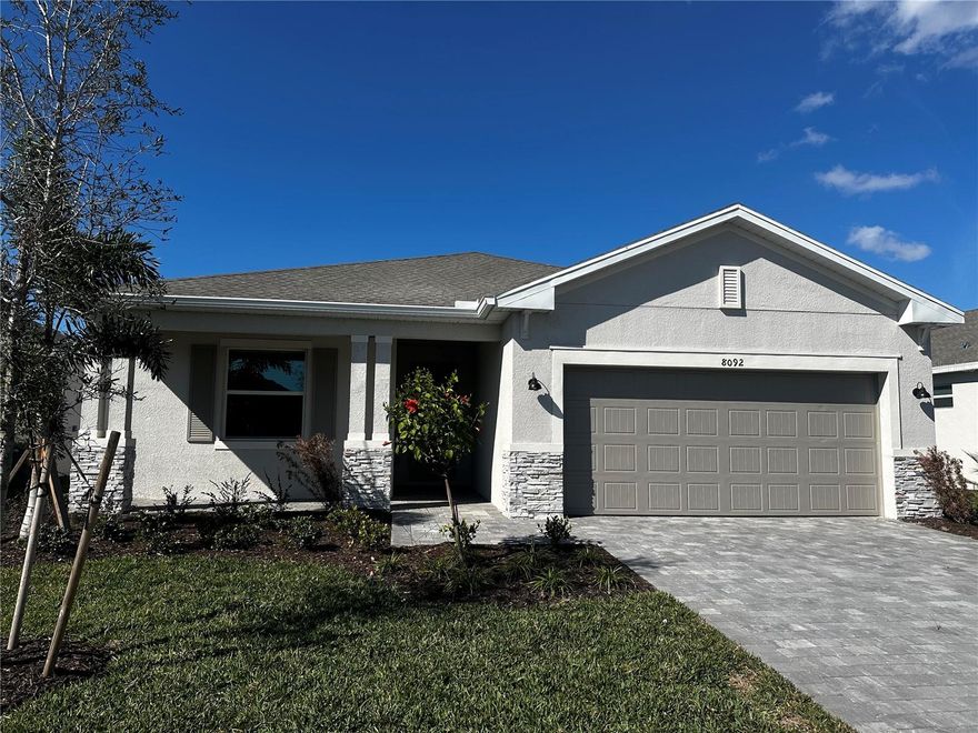 Beautifully designed single-story home in Island Lakes at Coco Bay, Englewood’s premier coastal community. This home is located in an X flood zone (no flood insurance required) and features impact-resistant windows for added peace of mind.

The open-concept floor plan seamlessly connects the kitchen, dining, and living areas—ideal for entertaining or everyday Florida living. The home features tile flooring throughout, a stylish kitchen with quartz countertops, all appliances included, and window blinds already in place. Step out to the covered lanai and unwind while enjoying breathtaking water views.
The split-bedroom layout offers privacy, with a spacious owner’s suite featuring a spa-inspired walk-in shower. One secondary bedroom includes its own en suite bath, perfect for guests or multigenerational living, while the third bedroom is conveniently located near a full bath.

HOA includes lawn care, high-speed internet, resort-style pool, clubhouse, pickleball courts, fitness center, and playground. Island Lakes offers a resort-style lifestyle in a beautifully planned coastal setting.