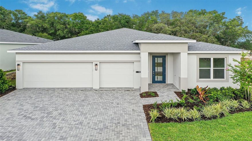 MOVE-IN READY NOW. Introducing the Pearl floorplan—a beautifully appointed single-family home nestled within a highly-sought, fully gated community, ensuring exceptional privacy, enhanced security, and a upscale lifestyle. Designed to meet the needs of modern families and discerning buyers, this expansive residence features 3 spacious bedrooms and 3 full bathrooms, including a versatile Bedroom 3 Suite—ideal as a guest retreat, home office, or multigenerational living space. An open-concept family room seamlessly connects to a flexible bonus area, providing an inviting space for relaxation, work, or entertainment.
The heart of the home is a gourmet kitchen, expertly crafted for culinary enthusiasts and social gatherings. Enjoy premium Level 2 cabinetry, a convenient pot-and-pan cabinet, and an upgraded 24" deep cabinet above the refrigerator for extra storage. The kitchen boasts a luxury quartz countertop, artisan tile backsplash, chimney-style exhaust hood, and top-of-the-line GE stainless steel appliances—including a 30" gas cooktop, under-cabinet hood, wall oven, built-in microwave with trim kit, and dishwasher. Elegant crown molding and modern finishes create a truly upscale cooking experience, making this kitchen a standout feature for any homebuyer searching for a luxury kitchen.
The owner’s suite offers a tranquil retreat, highlighted by a deluxe extended frameless glass shower and tile-to-the-ceiling finishes for a spa-like ambiance. All bathrooms feature designer tile, upgraded fixtures, and elegant frameless enclosures, ensuring both style and convenience. Laminate wood plank flooring runs throughout the main living areas, flex room, laundry, owner’s suite, and walk-in closet, blending durability with contemporary style. Cresswind at Hammock Oaks, a new active 55+ community by Kolter Homes, is situated in Lady Lake, FL, famously known as the “home of lakes and sunshine.” Located near The Villages the community is only minutes from Leesburg and convenient to Orlando. This gated community in Central Florida features Cresswind's national award-winning "Set Yourself FREE" lifestyle program based on the cornerstones of Fitness, Relationships, Education and Entertainment. The resident-only clubhouse with a state-of-the-art fitness center and offers 55+ neighbors a place to gather and participate in social activities facilitated by a full-time Lifestyle Director. Outdoor amenities will include pickleball & tennis courts, walking trails, resort-style pool and spa, pool, event and entertainment areas. DISCLAIMER: Prices, financing, promotion, and offers subject to change without notice. Offers valid on new sales only. See Community Home Guides for details. All uploaded photos are stock photos of this floor plan. Actual home may differ from photos.