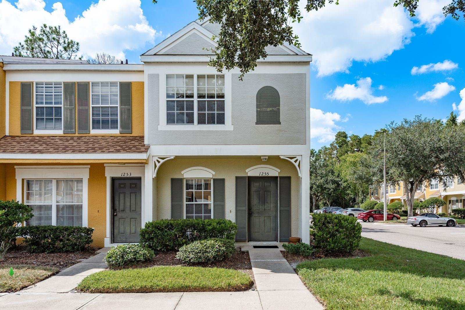 Welcome to 1255 Redondo Way, nestled in the gated neighborhood of Meadow Pointe, in Wesley Chapel. This is an incredible opportunity to bring your vision to life and add your personal touch. This property is full of potential with its solid bones (first level block/second level frame) and spacious open-concept layout. It’s the perfect canvas for a renovation or investment property! As you enter the home, the semi-open concept kitchen greets you with abundant storage, including a closet pantry, all white appliances, and a breakfast nook by the front window. Adjacent is a convenient half bath for guests, as well as space for a washer and dryer under the stairs. Filled with natural sunlight, the formal dining space and living room flow with plenty of room for any furniture configuration. Previous flooring has been removed on both levels for the buyer's convenience. Up the stairs are your two sizable bedrooms, both with soaring vaulted ceilings, en-suite bathrooms, and plenty of closet space. Step through the living rooms sliding glass doors onto the private, screened-in patio that overlooks the backyard, and also has a spacious storage closet. The roof of the home was updated in 2021, and the HVAC condenser was replaced in 2024. Meadow Pointe is a quiet community that features a clubhouse and community pool, just around the corner from the property. The Wesley Chapel location is unbeatable with proximity to desirable shopping like Wiregrass Mall and the Premium Outlets, an abundance of restaurant options, top medical facilities, and easy access to I-75, I-275, and Tampa International Airport. Whether you are a first-time buyer eager to customize your dream home or an investor searching for your next project, this home offers endless possibilities. Unlock the hidden value and create something truly special!