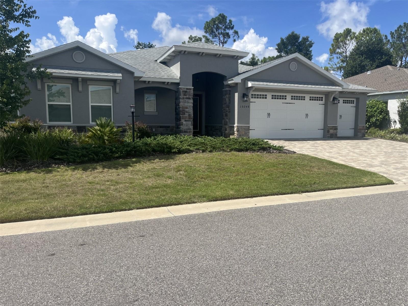 Come and relax in this well maintained Wellington model Home in Long Leaf Ridge Phase 1 in On Top Of The World. This smart home has it all starting with the Majestic front doors leads you into the open floor plan of the gourmet kitchen, living room and dinning area under the high tray ceilings there you will have a panoramic view of the golf course while entertaining your guest. The large Lani will serve as an evening retreat for those who would like to relax with a coffee or your favorite beverage. The room off the kitchen would be a great place for the media fanatics or a formal dinning room. The master Bedroom is fitted with a very large walk in closet with built-ins. The spacious Master bath sports a large roman shower. The guest rooms share another large bath room with walk in closets. The Laundry room has plenty of cabinet space and a counter for folding clothes. step into the three car garage that will also accommodate a golf cart. This home has it all. a very special home for the discriminating Buyer.
