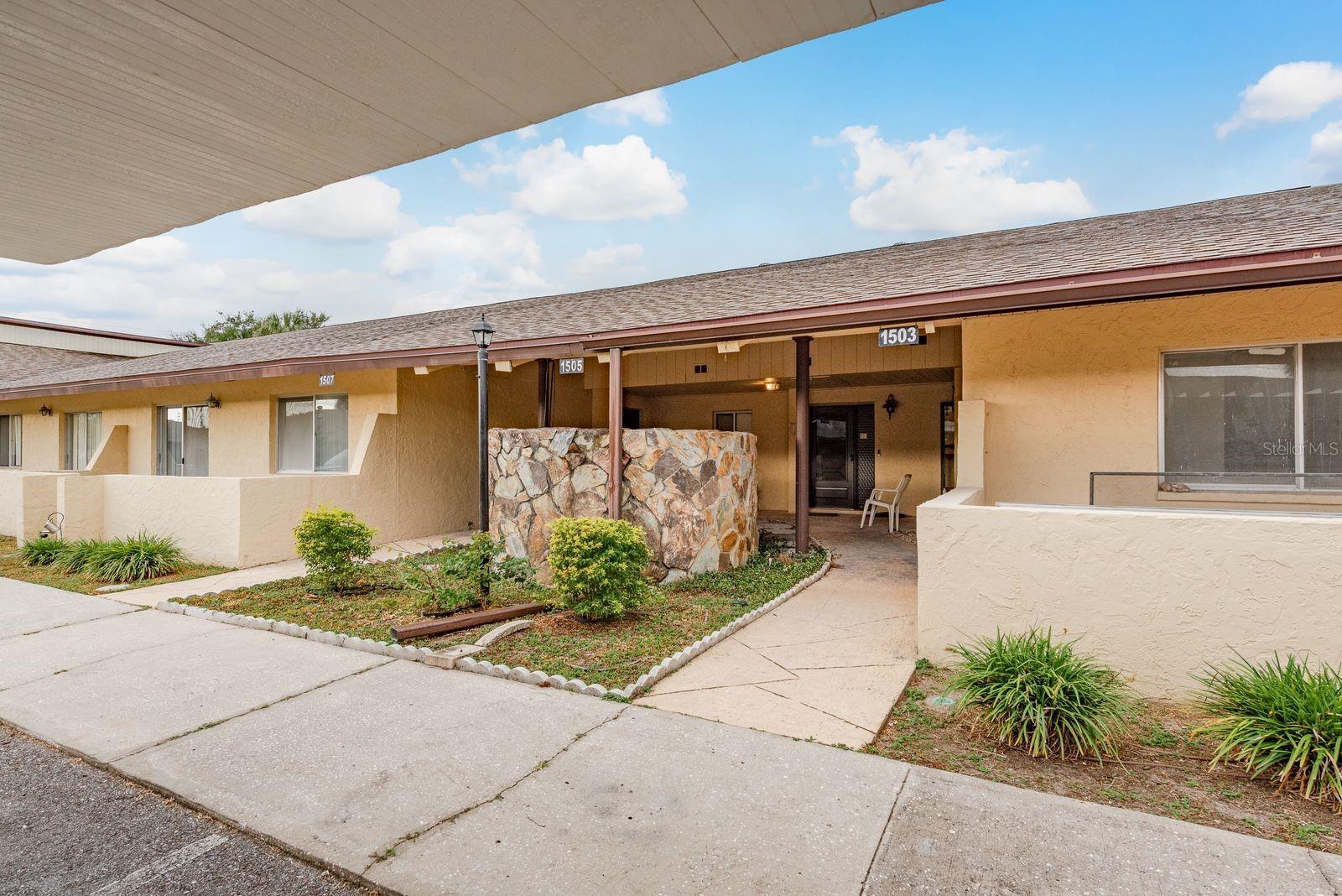 Welcome to New Haven Condos, an inviting 55+ community in the heart of Largo where comfort, convenience, and a relaxed Florida lifestyle meet. This beautifully maintained two-bedroom, two-bath villa exudes warmth with its great, open floor plan, and stylish vinyl plank flooring. The kitchen features wood cabinetry, modern appliances, and a pass-through, creating an effortless flow for entertaining. A spacious primary suite offers a private bath and generous walk in closet space, while the guest bedroom and second full bath provide the perfect retreat for family or visitors. Enjoy peaceful mornings in the enclosed Florida room overlooking a lush greenbelt, or take advantage of resort-style amenities including a community pool, clubhouse, tennis and shuffleboard courts. Small pets are welcome, and the monthly HOA covers cable, internet, exterior and grounds maintenance, water, sewer, and trash. Conveniently located near shopping, dining, medical centers, and Gulf beaches—maintenance-free living awaits in this charming Largo community. Please schedule your private tour today.