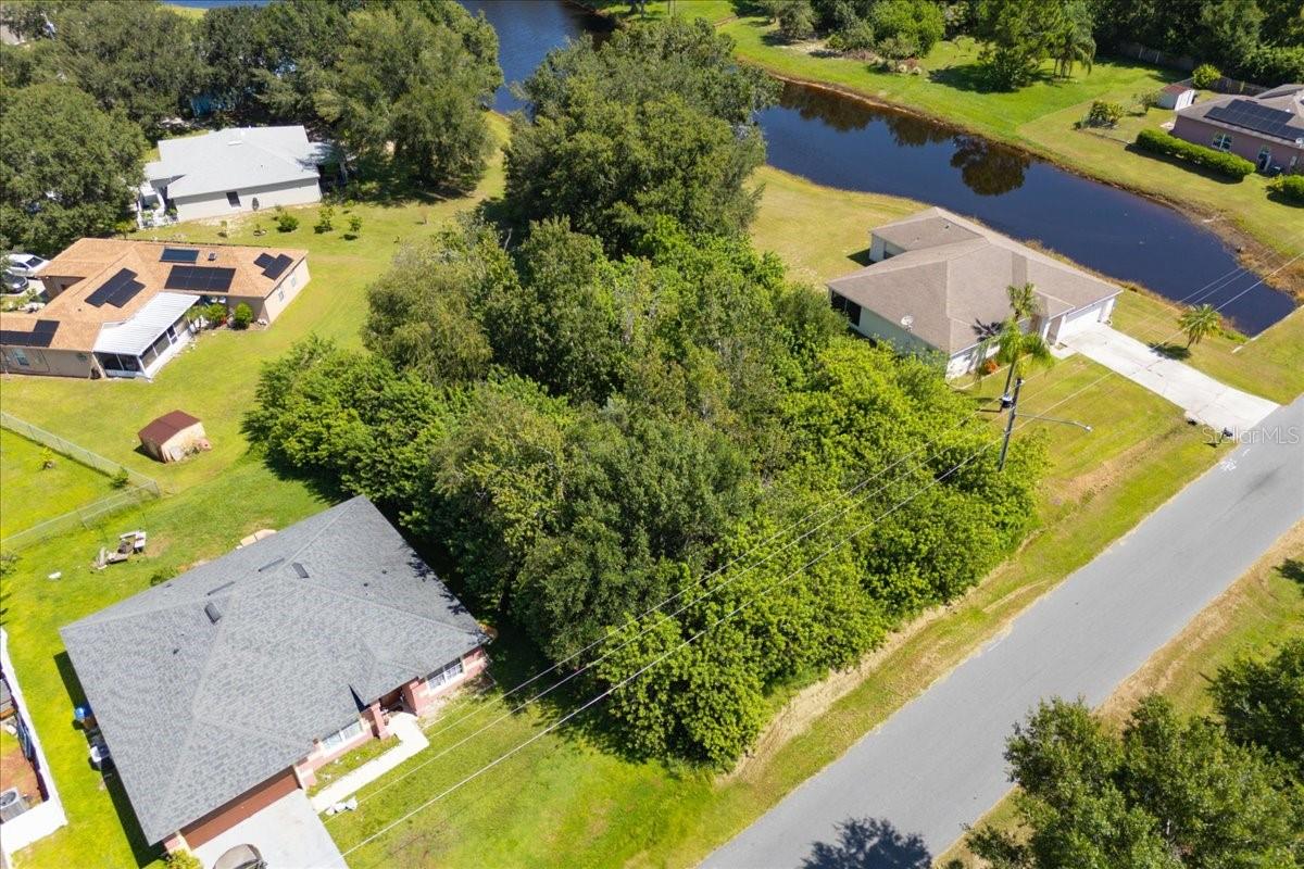 Build your dream home on this BEAUTIFUL lot in the Osceola County side of Poinciana. The lot is located inside the community of Poinciana Village, which features amenities as a community pool, a clubhouse, and a Recreation Center. At the center, you can enjoy several sports such as football, soccer, tennis, racquetball, baseball, and softball. There are also fitness trails, parks, dog parks, and lakes for fishing. The location is amazing with minutes to shopping centers, restaurants, medical offices, a brand new Hospital, Banks, bus lines, schools, and Valencia College campus. Just 13 miles to 17/92, 17 miles to Champions Gate, 18miles to I-4. Very close to theme parks and other attractions.