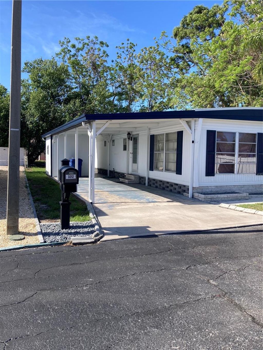 Photo of 3212 W Tiki Drive, Holiday, FL 34691 (MLS # TB8496586)