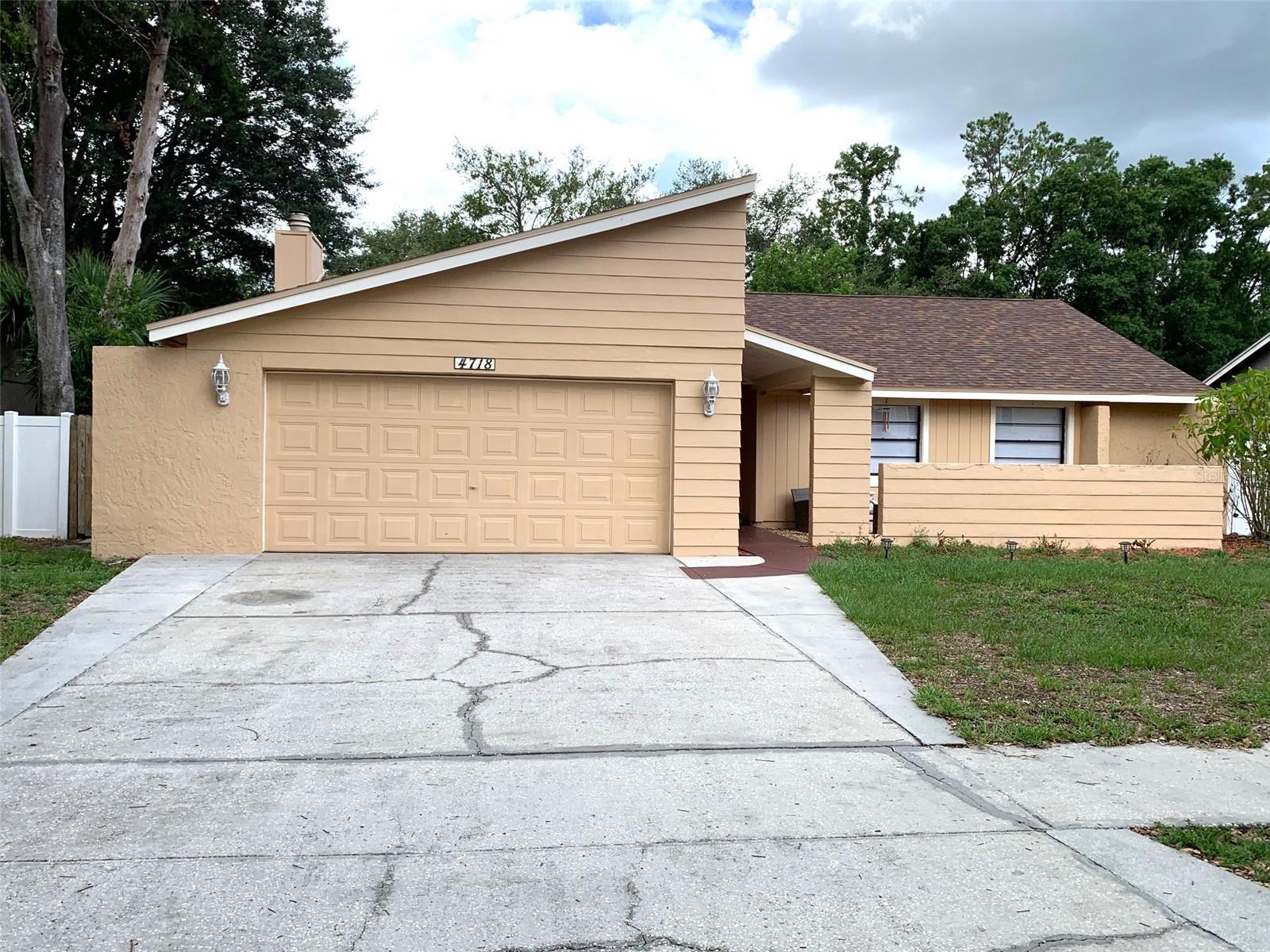 Spacious 3 bedrooms home in Country Place/ Carrollwood with huge yard. This home offers large living room and family room w/ fireplace, kitchen with lots of cabinets, newer AC unit and ceiling fans in all rooms. Covered back patio and 2 storage sheds in backyard with plenty of space to park small trailer/ boat on the side of house. Excellent location in Carrollwood area with great schools, shopping and entertainment. Schedule your tour today. It won't last long!
