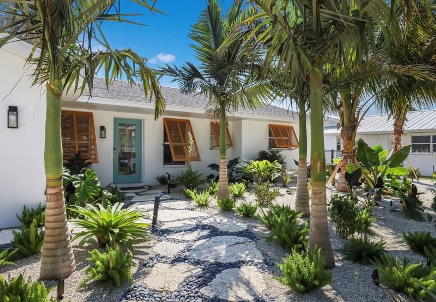 This gorgeous TURN KEY home embodies the epitome of coastal living. Nestled in the highly sought-after area of Holmes Beach in Anna Maria Island, this contemporary bungalow is a true gem that offers the perfect blend of comfort and classic beach living. A total renovation and transformation was completed in 2022, and this exquisite heated pool and spa home now boasts three bedrooms, two bathrooms, and an open living area providing ample space for entertainment. The deep water canal view greets you as you step outside, and adding to the allure, this property comes complete with a putting green and eating area alongside of the pristine swimming pool/spa area and new Trex dock with a BRAND NEW LIFT, perfect for unwinding after a long day or hosting unforgettable gatherings with family and friends.This bungalow is a testament to luxurious coastal living at its finest. With contemporary finishes and meticulous attention to detail throughout, no expense has been spared in its renovation. From the elegant and tasteful tile flooring and state-of-the-art appliances to the artfully designed bathrooms and spacious bedrooms, every aspect of this home exudes sophistication and charm. Whether you're seeking a peaceful retreat or a prime investment opportunity, now is the perfect time to make this magnificent property your own. Don't miss out on the chance to indulge in the ultimate Anna Maria Island lifestyle.