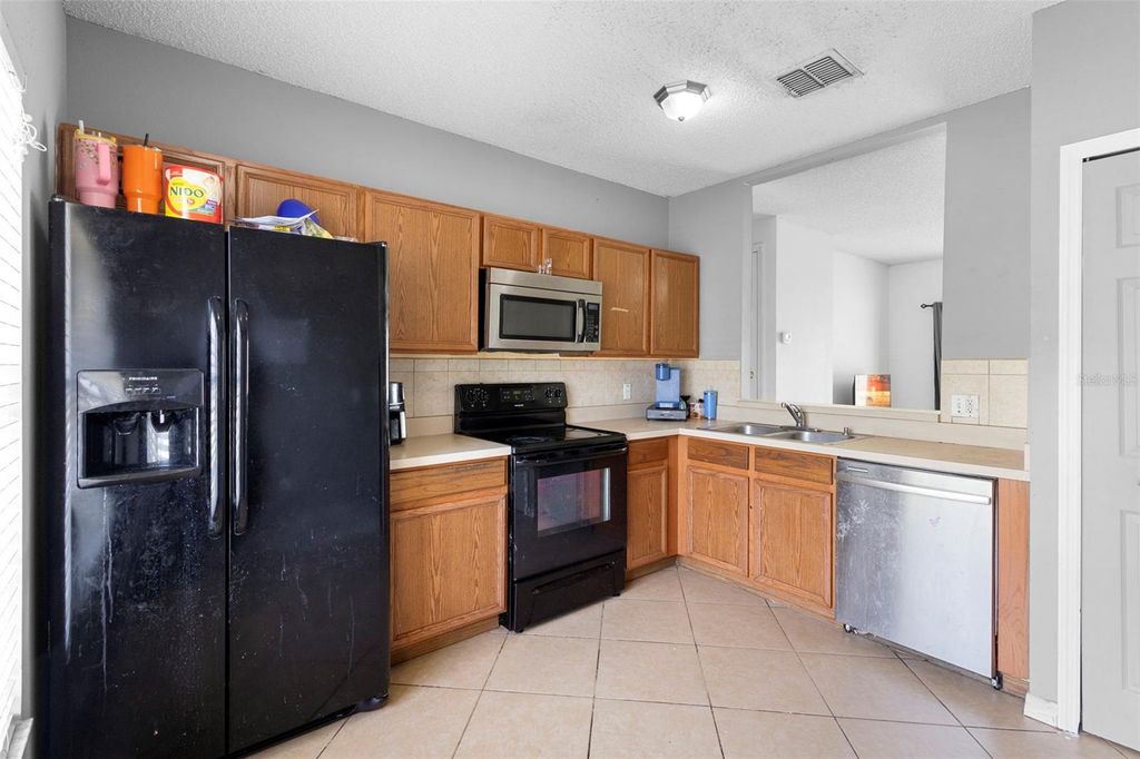 Photo of 1040 Cannock Drive, Kissimmee, FL 34758 (MLS # O6325935)