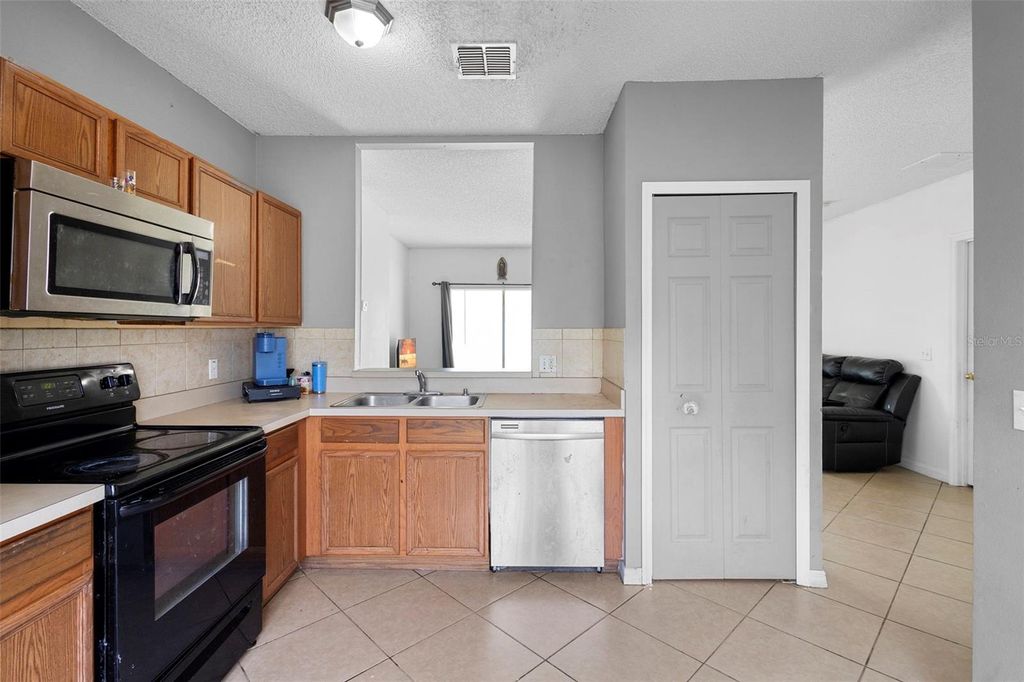 Photo of 1040 Cannock Drive, Kissimmee, FL 34758 (MLS # O6325935)