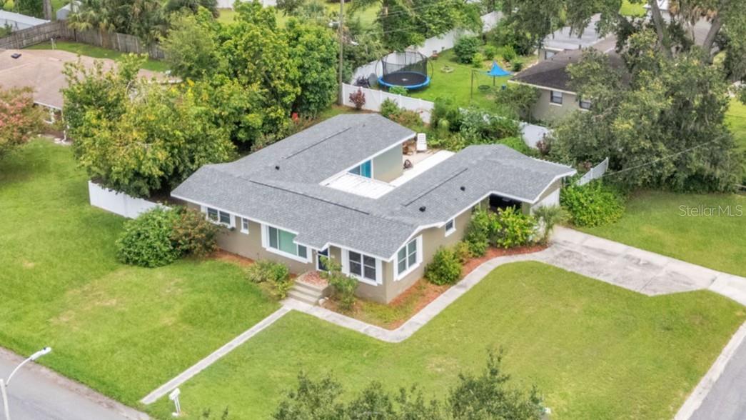 LOCATION, LOCATION, LOCATION! This well maintained 3-bedroom 2 bath home on a corner lot is located in central Lakeland near Handley Park, a beautiful, neighborhood park. Character and charm throughout including beautiful hardwood flooring! A great feature of this home is that it wraps around the pool area on three sides. Whether from the living room, kitchen or the three bedrooms, you have a view through one of the 5 sliding glass doors of the pool area. Lots of natural light in the spacious living room with sliding doors to a screened lanai, perfect for that morning cup of coffee. The kitchen with plenty of cabinets, opens to the dining room and both spaces are located on the east wing of the home. The primary bedroom has a built-in closet and a beautiful bath. Both the second and third bedrooms are spacious and are located on the west wing of the home. The guest bath located at the end of the hallway has a tub/shower combination. Outside, the home has a nice, attached carport with a garage door installed. Roof installed fall 2023, AC installed 2023. This quiet centrally located home is close to beautiful Lake Hollingsworth, Common Grounds Park, trendy Dixieland, as well as Lakeland’s historic downtown. Walk or bike to restaurants and shops located along E. Edgewood Drive. You’re also steps away from a walking trail that leads to Petersen Park, Cleveland Heights Golf Course and dog park. Lakeside Village Town Center is just a few minutes' drive with several shops, restaurants, bookstore and IMAX movie theater. This home has easy access to 570 Polk Parkway at Lakeland Highlands, and I-4 to Tampa, Orlando/Disney and the Atlantic and Gulf Coast Beaches. A home like this does not come on the market often! Schedule your Showing Today!