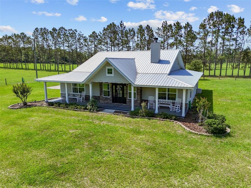 Discover the enchantment of Circle M Ranch, a 392.75-acre oasis along the spring-fed Santa Fe River—one of the last large private riverfront tracts in Columbia County, FL. With over 3,760 feet of river frontage, this stunning retreat offers 159 acres of fenced pastures, shaded by oaks and pines, and a 121-acre neighboring woodland ideal for expansion. Explore 80 acres of hardwoods along the river, with only 34 acres of wetlands. Wildlife abounds—deer, turkey, rabbits—and protected land across the river ensures lasting peace and privacy. The property includes a 2,030 sq ft 3BR/2.5BA home, a 30’x25’ barn, plus a 2BR/2BA guest house with a 24’x20’ barn. A 40’x40’ workshop and 6” well support all agricultural needs. A private boat landing offers direct river access. More than a ranch—it’s a private sanctuary where nature and serenity thrive