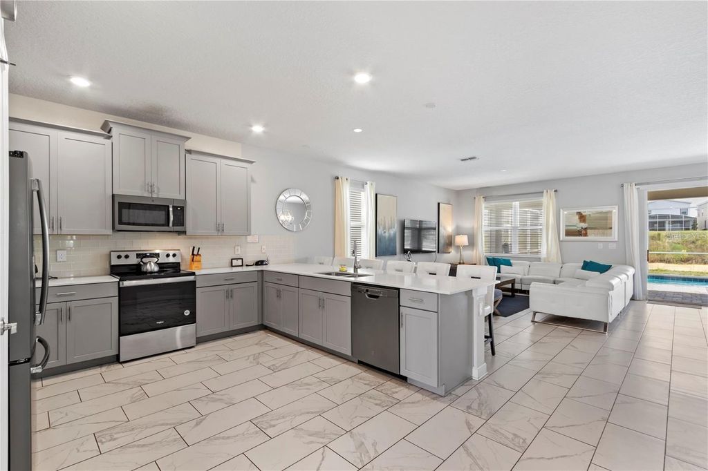 Photo of 541 Pebble Beach Drive, Davenport, FL 33896 (MLS # O6351304)