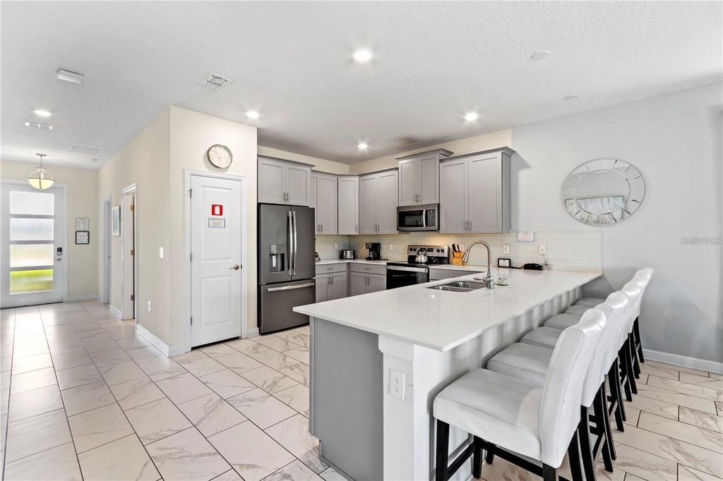 Photo of 541 Pebble Beach Drive, Davenport, FL 33896 (MLS # O6351304)