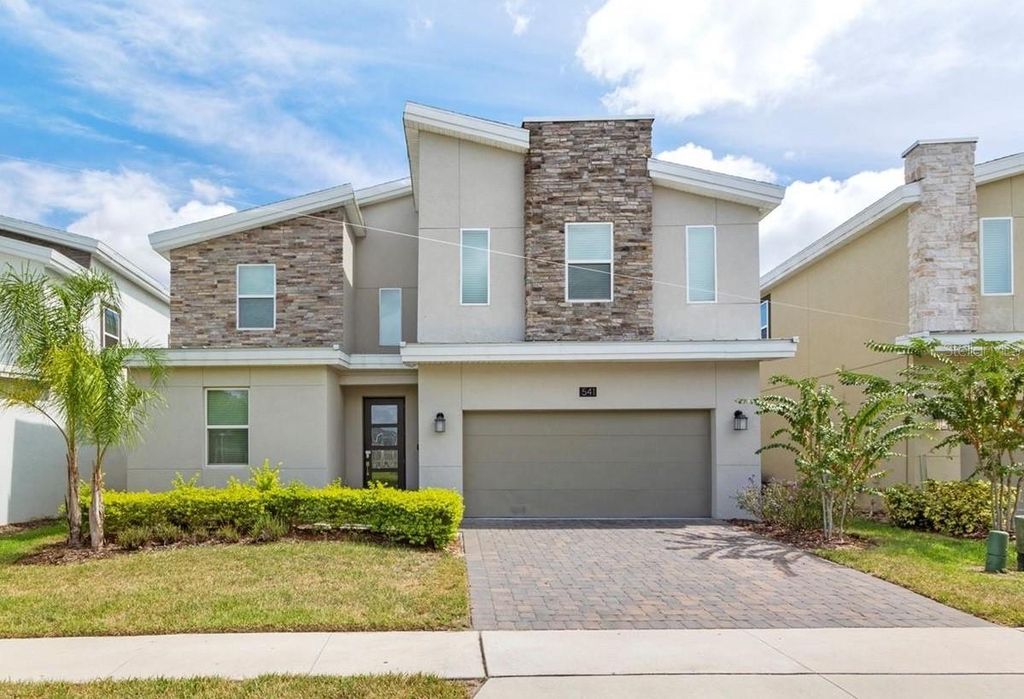 Photo of 541 Pebble Beach Drive, Davenport, FL 33896 (MLS # O6351304)