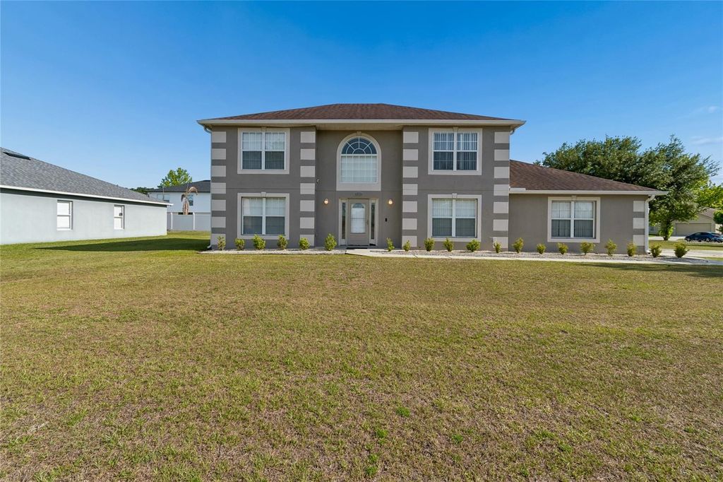 Photo of 2789 Woodland Creek Loop, Kissimmee, FL 34744 (MLS # O6409086)