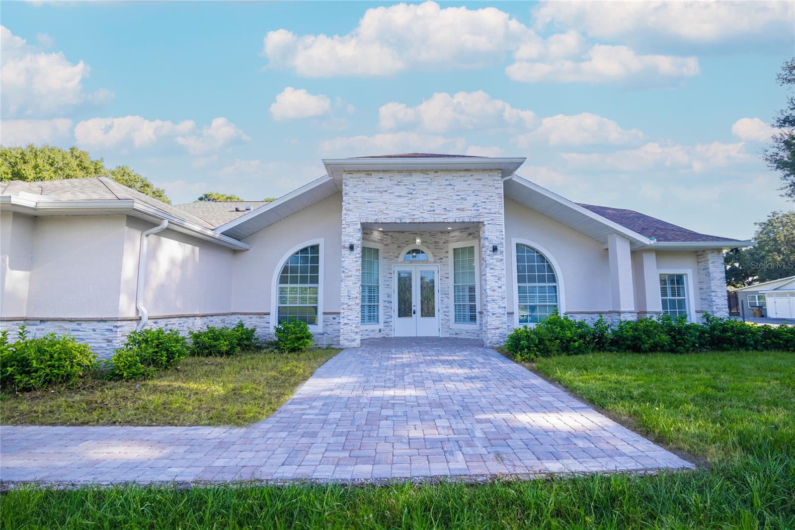 This beautiful and majestic property sits on approximately 2.4 acres in the highly desirable Estates of Toho community. NO HOA. IT HAS THREE (3) SPACIOUS BEDROOMS AND THREE LARGE AND RENOVATED BATHROOMS. This property is surrounded by beautiful oak and palm trees. AND WITH ENOUGH LAND TO ENJOY THE COUNTRY IN THE CITY AND PLANTING MANY TREES AND FRUITS THAT YOU HAVE WANTED OR PLANNED.This real estate gem makes it your work place, your refuge, your resting place, where you enjoy your vacations or a place to gather and enjoy with your family and friends at a very affordable price. You will love the peace and quiet here. It is a heavenly outdoor place with endless sunrises and sunsets, birds singing. It has an impressive entrance with high ceilings and several sitting areas on both sides. The beautiful and enormous kitchen has plenty of space, lots of cabinetry, and all stainless steel appliances. A spacious family room and dining room. A sunny Florida-style living room opens onto a beautiful deck, opened by a French door and protected by a screen, with a wide paver floor. This home was completely renovated in 2024. NEW ROOF, NEW A/C, NEW WATER HEATER, WIDE AND ELEGANTLY SELECTED FLOORS. Come discover how wonderful your life can be on these 2.4 acres of land, away from the noise and minutes from everything. Turn left a few minutes ahead and you will find Lake Toho, with nearby access to the public boat ramp, ideal for recreational activities. Famous for its bass fishing and access to Lake Tohopekaliga's chain of ski lakes and navigation locks. Ideal for owners and investors who want to live in the main house and, why not, build a guesthouse or something else soon if they wish. A great opportunity to build equity quickly. And, not to forget, this property is close to everything. Minutes from major highways, very close to theme parks, restaurants, hospitals, doctors' offices, supermarkets, shopping centers, and offices. GIVE YOURSELF THE OPPORTUNITY TO OWN THIS GEM AND CALL FOR AN EXCLUSIVE VIEWING!