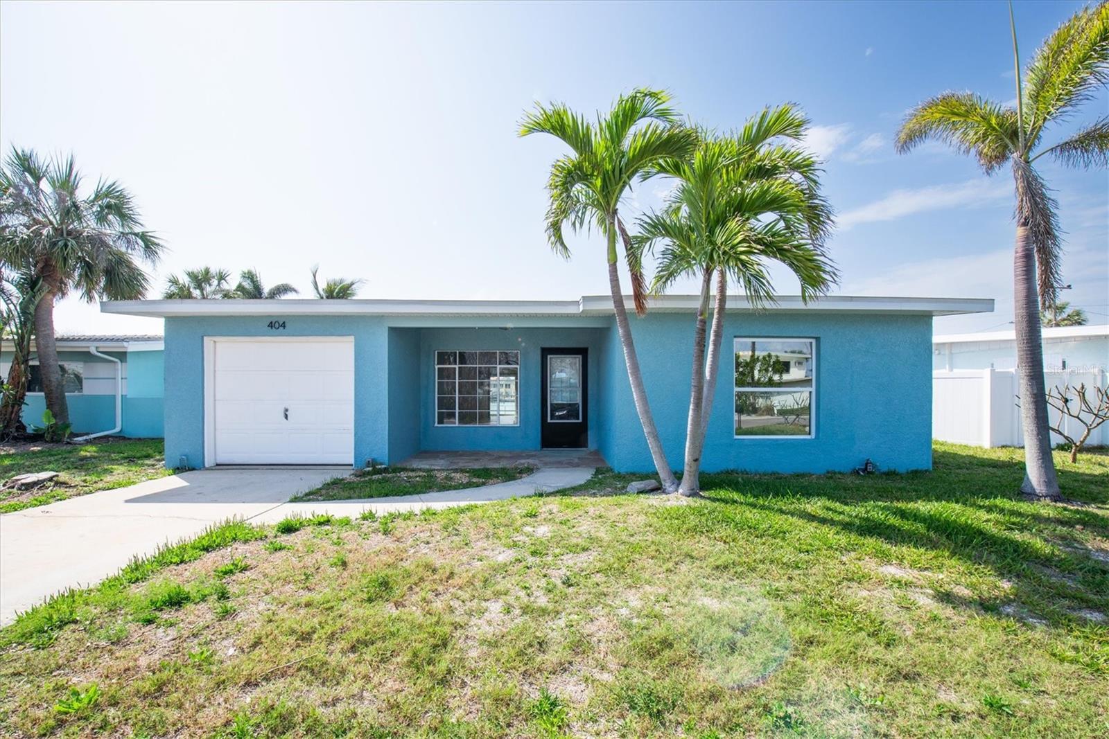 Imagine stepping into a coastal haven nestled along the tranquil waters of Madeira Beach, Florida. This stunning 3-bedroom, 3-bathroom home offers an unparalleled waterfront lifestyle, boasting a small garage and a private boat lift dock on the Intracoastal Waterway. Stepping inside, you are greeted by an inviting atmosphere of coastal charm. The spacious living area is bathed in natural light, courtesy of large windows and sliders that frame breathtaking views of the water. The heart of the home is the kitchen with countertops, and custom cabinetry. Whether you're whipping up a meal for family and friends or simply enjoying a quiet breakfast while looking out at the water.The primary bedroom is a true retreat, offering views of the water and direct access to backyard where you can soak in the stunning sunsets. The ensuite bathroom is a spa-like oasis, complete with a large walk-in closet, his and her sinks, and large shower. Two additional bedrooms offer ample space for guests or family members, each thoughtfully designed with comfort and style in mind. Outside, the expansive yard is the perfect place to entertain guests or unwind after a long day. The boat lift dock provides easy access to the water, allowing you to explore the Intracoastal and beyond with ease. This home is not just a place to live; it's a lifestyle. With its prime waterfront location, luxurious amenities, and breathtaking views, this Madeira Beach gem offers the ultimate in coastal living.