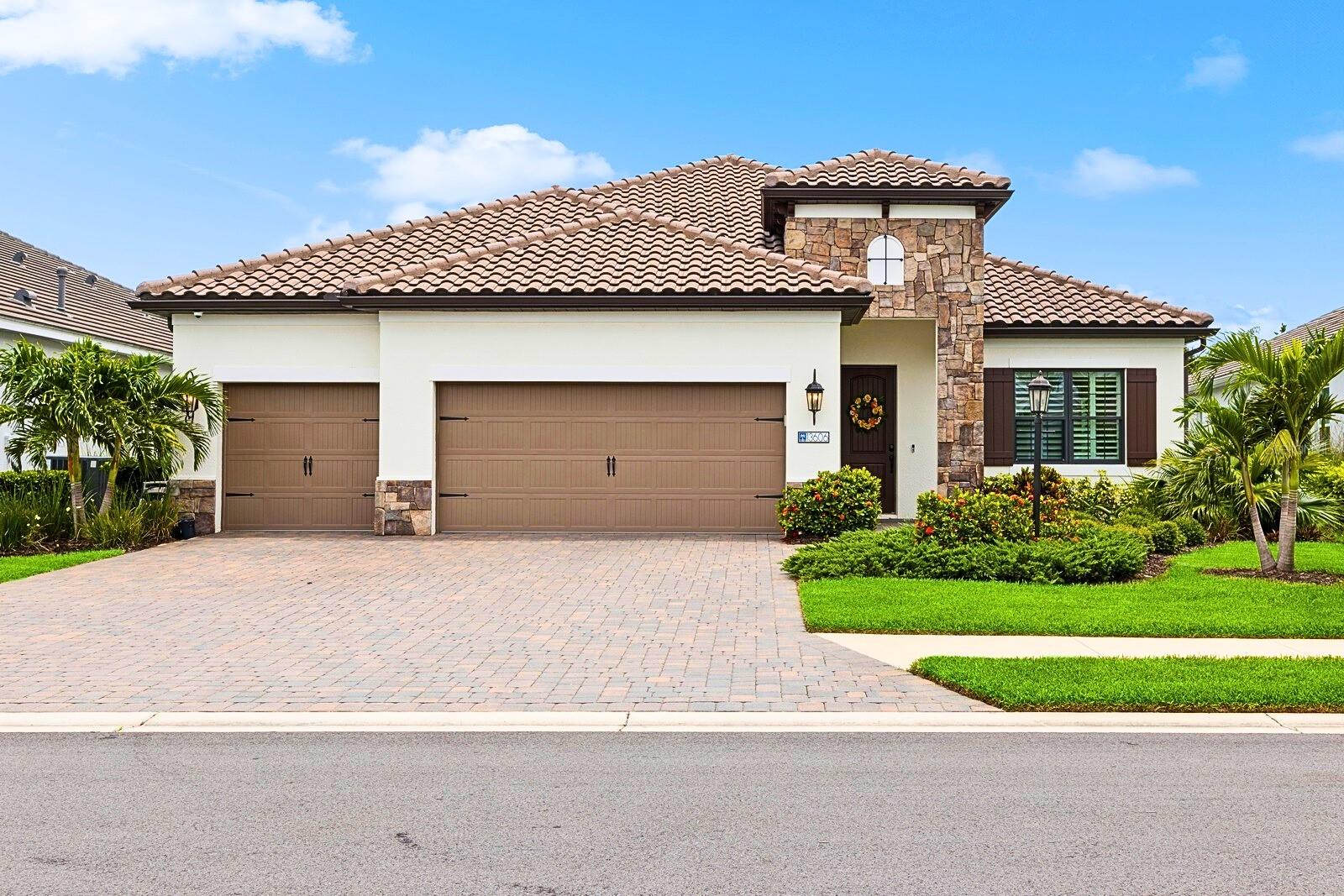 Welcome to Indigo, a gated, maintenance free community surrounded by nature, offering a peaceful setting in the heart of Lakewood Ranch. This Neal-built Daybreak floor plan offers both space and versatility, featuring 3 bedrooms, 2.5 bathrooms, an office/den, and both a formal living room and a spacious great room. Thoughtfully designed, this 3-way split floor plan provides just the right amount of separation and flow with plantation shutters and wood-look tile floors throughout. The primary suite is tucked away on one side for privacy, complete with a coffered ceiling, custom accent wall, two walk in closets, and a serene en suite bath. On the opposite side of the home are two additional bedrooms, while an office sits at the back of the home, ideal for working remotely or hosting guests, with convenient access to the pool bath. The formal sitting room at the front of the home adds extra flexibility and can easily be transformed into a second office, den, or playroom. At the heart of the home, the open concept great room and gourmet kitchen create a warm and inviting atmosphere, with a large center island, gas range, walk-in pantry, and seamless flow into the dining area. A coffered ceiling with wood inlays, built-in speakers and a new built-in electric fireplace and adorns the great room adding a touch of warmth and sophistication. Enjoy Florida living at its finest in the beautiful and private outdoor space, featuring peaceful water views, a sparkling saltwater pool with sun shelf, a built-in summer kitchen, and plenty of deck space to relax or entertain. The home features hurricane impact windows for year-round peace of mind and is located in the desirable “X” flood zone.
Indigo residents enjoy access to resort style amenities including a heated community pool, pickleball courts, clubhouse, fitness center, playground and lifestyle director. All just minutes from top-rated Lakewood Ranch schools and the vibrant shopping, dining, and events that make the area so desirable.