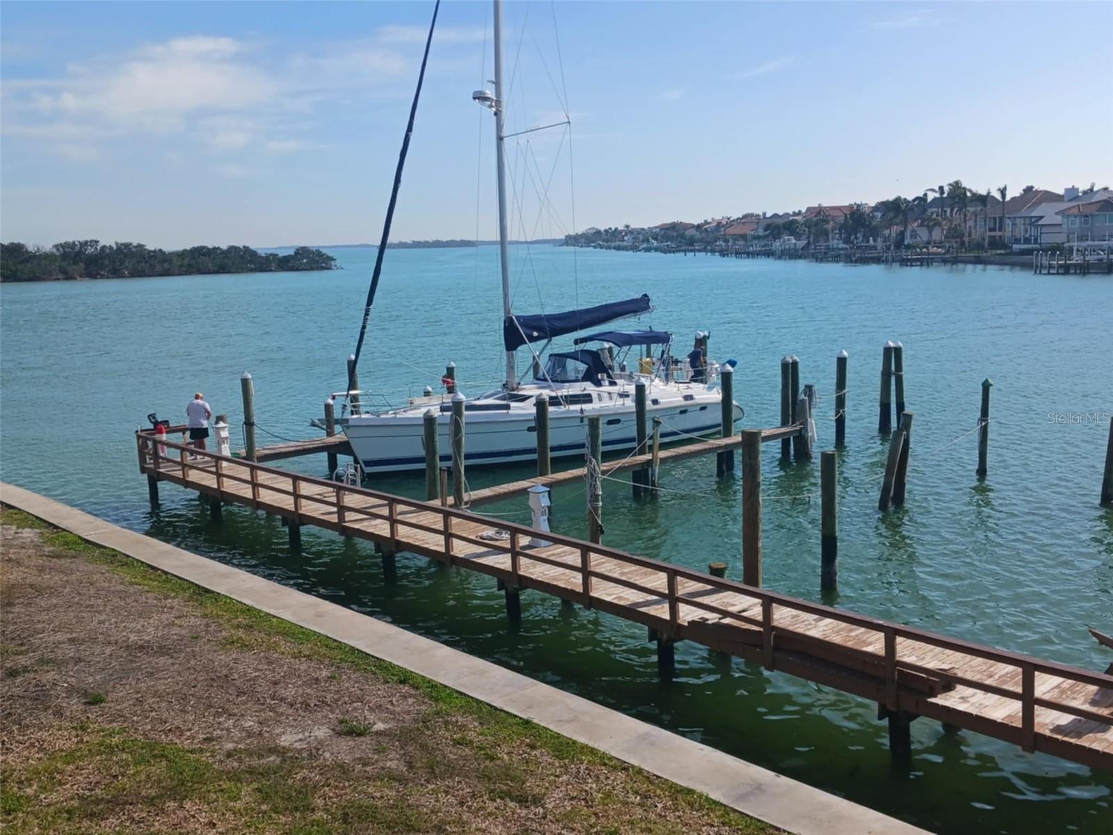 Experience luxury waterfront living in this expansive townhome at The Village of Tierra Verde, complete with a true 20'x50' yacht dock—an exceptional and rare amenity. DOUBLE DOCK SLIP #47 & 48 The Very last 2 docks on the EAST END Community is Nestled in a Entrance Gated Community, this residence offers world-class amenities including three swimming pools, tennis courts, a clubhouse with a fully equipped fitness center, and 24-hour security. A full-time on-site property manager ensures the grounds and services are impeccably maintained. This multi-level townhome features a completely remodeled kitchen and bathrooms, including a spa-style jetted Jacuzzi tub designed for total relaxation. Although officially designated as a two-bedroom, this home features three adaptable bonus rooms, providing the practicality of a four-bedroom layout. GARAGE AND BONUS FLEX ROOM HAS ITS OWN AC GREAT FOR THE VINTAGE CORVETTE. Enjoy sweeping waterfront views—truly the kind money can buy—on the vibrant island of Tierra Verde, which is close to everything but miles from the ordinary! Where lifestyle seamlessly integrates with leisure, boating, dining, and entertainment, just moments from your doorstep.