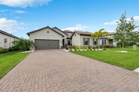 Photo of 2028 Woodleaf Hammock Court, Bradenton, FL 34211 (MLS # A4696734)