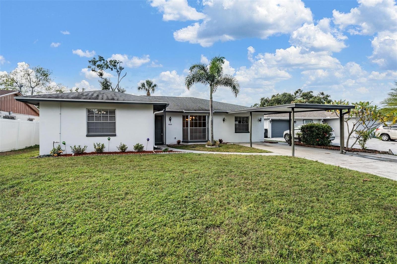 One or more photo(s) has been virtually staged. Welcome to this spacious and inviting 4-bedroom, 3-bath home offering the perfect blend of comfort, functionality, and Florida living! Step inside to a large great room ideal for relaxing or entertaining, and a generous dining area that overlooks the sparkling private pool. The open kitchen connects seamlessly to the dining space, making it easy to host gatherings and stay connected with family and guests. Each secondary bedroom is impressively spacious, providing plenty of room for everyone. The Primary Suite offers privacy and comfort, with en-suite bath, perfect for unwinding after a long day. One bedroom has been converted to a Game room / Bonus Room with a built in Bar. This area could be used for extra space for those out of town Guests. Outside, enjoy your own backyard oasis with a screened pool area, ideal for year-round fun and relaxation. Spacious screened room with Pool bath adds additional living space. Large inside Laundry room provides additional storage with a pantry. Located on a quiet Cul-De-Sac in the Town-N-Country community with No HOA, this home gives you the freedom to truly make it your own—bring your boat, or add personal touches without restrictions. Recently painted interior and exterior, Roof 2014, new Air conditioner 2024 and water heater in 2025. Conveniently close to shopping, dining, beaches, and major highways, this home is a must-see!