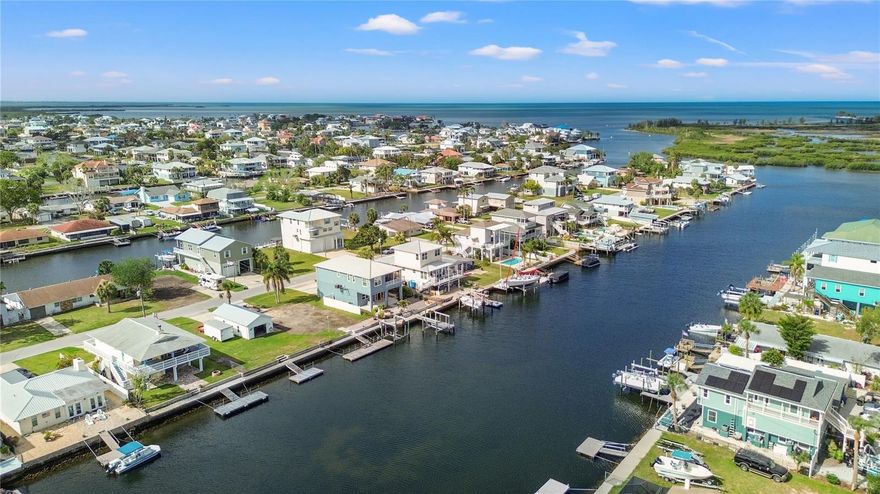 DIRECT GULF ACCESS!! This prime waterfront lot in beautiful Hernando Beach, Florida, offers a rare opportunity to build your dream home in a boater's paradise. With direct Gulf access, you can enjoy fishing, boating, and stunning water views right from your backyard. The property includes a full seawall and knee wall for added stability, along with a 32-foot dock and a boat lift for your vessel.

Once your home is built, you'll be treated to breathtaking views of the serene canal and surrounding mangroves. The brackish water provides a unique array of fish and water life for the passive viewer or the shoreline fisher.  Even better, there is an adjacent property available with a garage, offering a unique opportunity to expand your waterfront living space, add a workshop, or invest in additional land.

Don't miss your chance to own a slice of Florida’s coastal paradise. Contact us today for more details or to schedule a viewing!