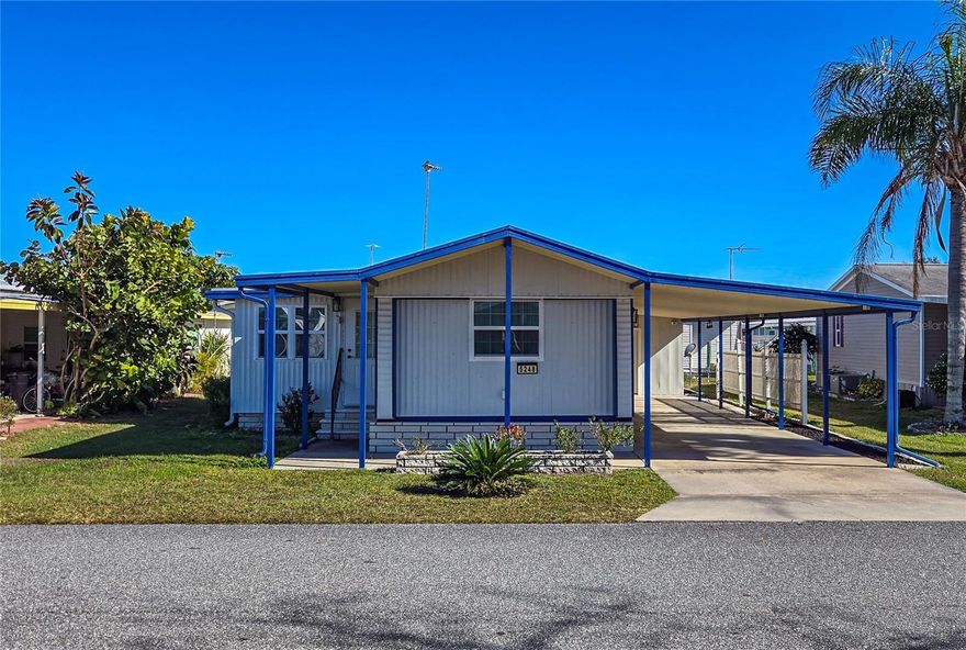 Looking for a Florida retreat or a full-time home? This beautifully updated, fully furnished 2-bedroom, 2-bath home is located in the Oaks Royal I & II active 55+ community, where you own the land and enjoy a low annual HOA fee of just $440.The updated kitchen features newer stainless steel appliances, updated fixtures, and a new sink. It opens directly to the living room, creating an easy, comfortable space for everyday living and entertaining. French doors lead to the Florida room, which has insulated walls and ceiling, thermal windows, laminate flooring, and a mini-split system. This makes it a true four-season room and a great space for relaxing or hosting friends.The home offers a split-bedroom layout for added privacy. The primary bedroom has carpet, a ceiling fan, and an ensuite bath with a step-in shower. The second bedroom, located at the opposite end of the home, features laminate flooring, a ceiling fan, and built-in closet shelving. The nearby second bathroom has been nicely updated with a granite-topped vanity, tub/shower combo, and a higher commode.Outside, you’ll find a double carport with an attached laundry, storage, and golf cart shed. The shed includes washer and dryer hookups and a roll-up door for easy golf cart access.Additional updates include a five-year-old AC system, a hot water heater replaced two years ago, and thermal pane windows throughout. An addendum lists all furnishings included in the sale.Schedule your showing today and don’t miss this move-in-ready Florida home.