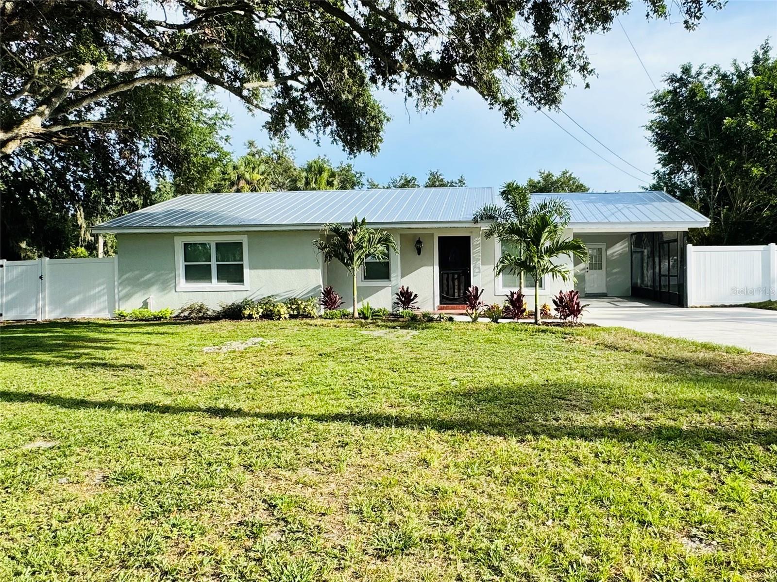 Welcome to 7013 Symmes Rd. Gibsonton FL 33534 a beautifully renovated home, ready for a new family to move in. Offering 1,405 sq. ft. of modern space in a no HOA, no-CDD community. This beautiful home sits in a large lot measuring .45 acre, which is very rare to find. The opportunities for this large backyard are endless. Step inside and you will find a fully renovated kitchen, with brand new cabinets, counters and appliances. New flooring throughout the house, fresh paint and fully renovated bathrooms. New roof 2025, AC replaced in 2023, and Septic and underground plumbing replaced in 2022.