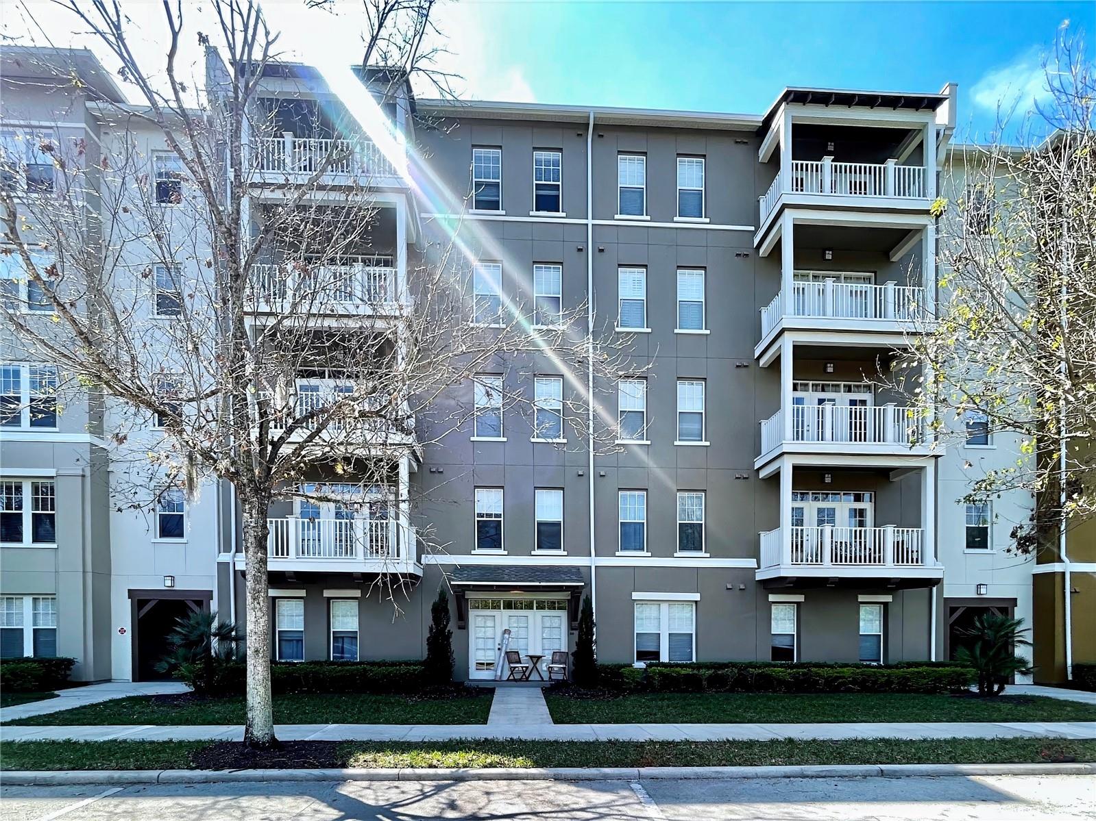 Great Deal! This 2 bed 2 full bath condo with open floor plan, is nestled in the coveted Artisan Park Village of Celebration Florida - the town Disney Built. You have lovely views from your second floor balcony, and are a quick commute to the exclusive Artisan Park Clubhouse, with the largest pool in Celebration, massive fitness center, private restaurant, and its host of community events that bring the neighborhood together. This unit has ALL LIVING ON ONE FLOOR and the building has ELEVATOR ACCESS. Your palatial living room has crown molding. There's plenty of space for cooking in the large kitchen with a separate eat-in space and a private desk space nook. The Primary bedroom features a large walk-in closet, and a spacious primary bathroom with dual sinks and garden tub with separate shower. Home conveys with a 1 Car Garage and a private storage unit closet. Water Utility is included in your condo dues. It's never far from Downtown Celebration with all its famous shops and restaurants and farmers market. Schedule a tour today!