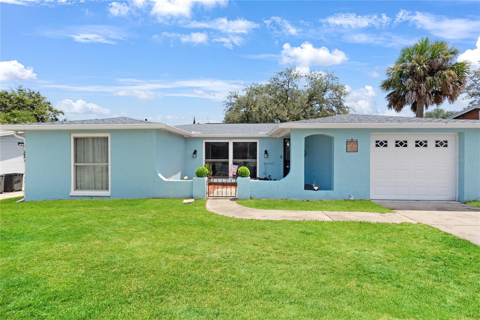 Port Richey ~ Cute as a button Florida style 3 Bedroom, 2 Bath home in a fabulous location. NO HOA or CDD'S! Close to State Parks, Beaches, Schools & Colleges, Shopping, Eateries & much more! Small town feel with big town conveniences. ROOF replaced in 2019 & NEW DUCTWORK 2017. This beautiful home is updated in all the right places . . . kitchen updates with GRANITE, cabinets, STAINLESS STEEL APPLIANCES including a glass top range, built-in microwave, DISHWASHER, large side by side refrigerator with exterior ice dispenser, STAINLESS STEEL sink with GOOSE NECK faucet & sprayer, decorative tile backsplash. Both full bathrooms have been updated as well with new plumbing fixtures, cabinets & Quartz countertops. NO CARPET! Split bedroom plan with nice size secondary bedrooms. Spacious rear lanai & fully fenced-in backyard perfect for family fun & your 4 legged family members. Plenty of room to add a pool! Call today to schedule your PRIVATE showing!