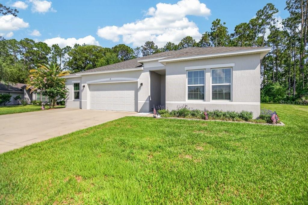 Photo of 14 Woodworth Drive, Palm Coast, FL 32164 (MLS # FC319517)
