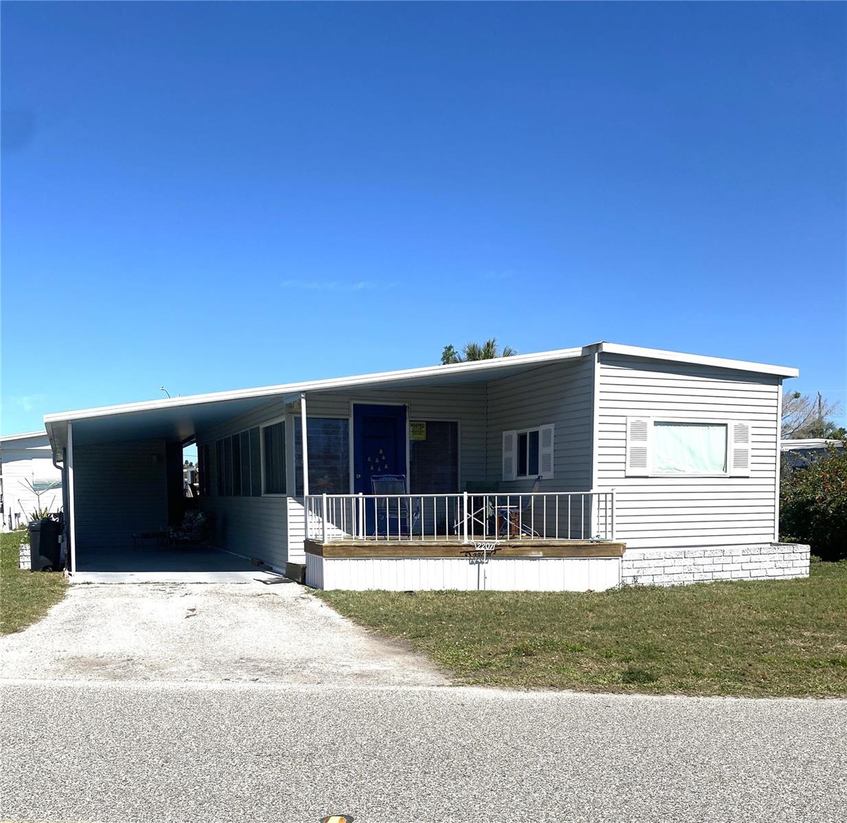 Motivated Seller. Bring reasonable offers! This 2-bedroom, 1.5-bath home in the highly sought-after 55+ Trailer Estates Marina Community offers an open layout with a living room that extends the length of the home, connecting to the dining area and kitchen. Enjoy Florida’s coastal lifestyle from the front porch, which offers glimpses of Sarasota Bay through the homes across the street, or relax on the private back deck. Inside, beadboard details in the dining room add to the home’s character, and the property is being sold with most furnishings. The roof has been perma-coated. A FEMA flood insurance policy is in place and transfers to the new owner, providing added peace of mind.
Trailer Estates is a land-owned community with no lot rent, HOA, or CDD fee! The self-governing special tax district covers cable, internet, trash pickup, fire and rescue services, park management, and access to extensive amenities, including a marina with boat slips (as low as $600/year), a private beach, pool, hot tub, fitness center, shuffleboard, bocce ball, pickleball, and over 60 active clubs and social events. Whether you’re looking for a full-time home or a seasonal retreat, this property offers the perfect blend of comfort, charm, and an unbeatable location in one of Sarasota Bay’s most desirable communities. Buyer to verify listing details including process to transfer insurance.