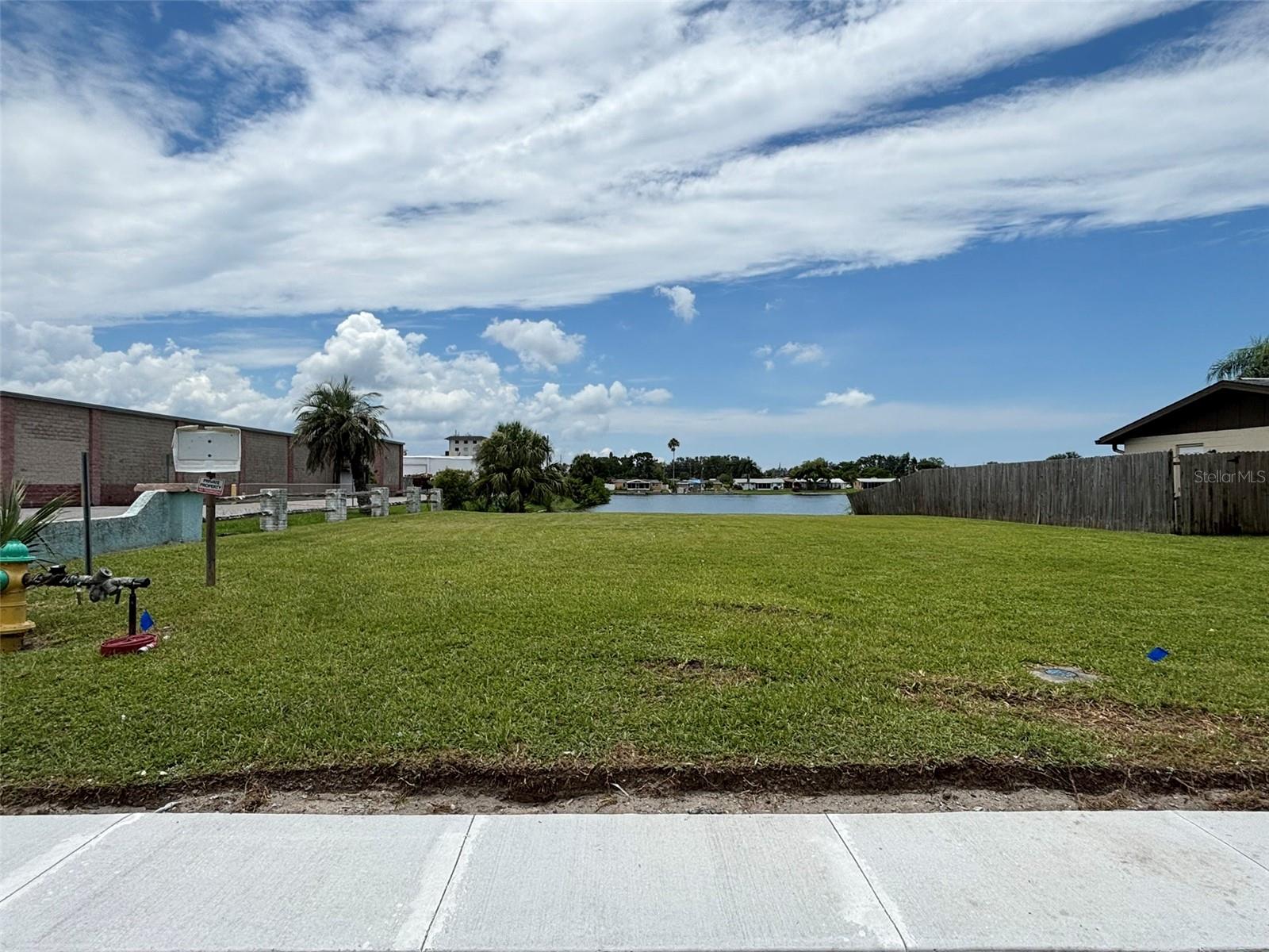 Dreaming of the perfect waterfront escape? I found a beautiful corner lot in Aloha Gardens that feels like paradise! This meticulously maintained waterfront corner lot presents an exceptional opportunity for realization of its full potential. Whether you are a builder seeking your next venture or an individual in search of the ideal location to construct your dream home, Aloha Gardens offers a serene environment perfect for establishing roots. Imagine waking up and soaking in the Florida sunshine. This place is not just about land; it’s about making memories and building YOUR home. It’s the perfect spot to settle down. Let’s make this dream a reality! This waterfront property boasts the tranquility of Conley Lake, which connects to Holiday Lake, providing stunning views, opportunities for outdoor enjoyment, and some good ole fishing. It’s an ideal setting to begin and conclude your days while basking in the vibrant Florida lifestyle. Aloha Gardens is characterized by its peaceful atmosphere, devoid of any homeowners' association, and recently enhanced with newly installed sidewalks. Residents have not encountered any flooding issues, ensuring a secure living experience. Conveniently situated near parks, beaches, restaurants, shopping centers, and the myriad attractions that Florida has to provide, this location is truly desirable. With land becoming increasingly scarce, now is the perfect moment to seize this opportunity. Let’s make this property yours!