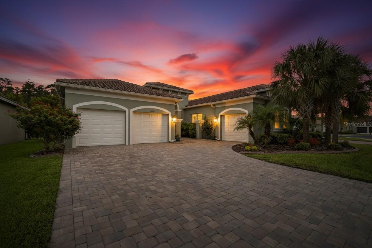 Stunning Carlyle Floor Plan in Gated 55+ Valencia Lakes Community! This beautifully upgraded 3,013 sq ft home is located in the highly sought-after, golf cart-friendly Valencia Lakes by GL Homes. Enjoy resort-style living with a massive clubhouse, fitness center, lap and resistance pools, a relaxing pool, dedicated pickleball courts, tennis, ballroom events, pet park, softball field, garden area, game/card rooms, billiards, woodshop, art studios, RV parking (based on availability) and more!
This spacious home offers 3 bedrooms and 3.5 baths including a huge primary suite with dual walk-in closets featuring built-in organizers, plus a second ensuite guest bedroom—perfect for privacy in the split-bedroom layout. The third bedroom, along with a versatile Club Room, is ideal for a home office, den, or game room.
Upgrades include 4.5-inch plantation shutters throughout, gorgeous, Villa Bocelli Soronno engineered hardwood floors, high-end Karastan carpet in the secondary bedrooms, crown molding, custom built-ins, and a gourmet kitchen with upgraded cabinetry, glass door accents, slider drawers, bar seating, and a dinette overlooking peaceful conservation views.
Additional highlights: 3-car split garage with epoxy floors and overhead storage racks, tile roof, water softener, screened lanai with Sunbrella remote-controlled retractable sunshade with electric and lights, new Bosch dishwasher, whole house gutters and more. Experience the ultimate active adult lifestyle—schedule your private tour today!