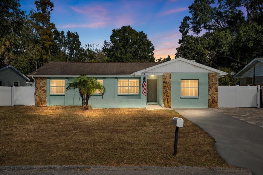 Tucked into a quiet pocket of Tampa, Lowry Park Central, this four bedroom, two bath home feels instantly comfortable the moment you step inside. The layout opens into a bright main living area that naturally draws you toward the kitchen, where modern updates blend seamlessly with everyday function. Stone countertops, stainless steel appliances and thoughtful storage make it a space that’s as easy for comfortable everyday living and entertaining. 
Just beyond the kitchen is a flexible room that adapts to whatever your life needs most. It could be a cozy second living space, a play area, a dining room for long Sunday breakfasts, or a place to sit by the fireplace on cooler nights. The bedrooms offer a calm, simple backdrop for rest, and the refreshed bathrooms feel clean and comfortable with contemporary finishes.

The real surprise sits outdoors. Sliding doors open to a fully fenced, turfed backyard that creates a private little oasis right in the city. It’s low-maintenance, green year-round, and perfect for hosting friends or giving pets the run of the yard. Whether you’re grilling, unwinding after work, or watching a quiet sunset, this space becomes an extension of everyday living.  HVAC 2019, Windows 2019, Roof to be installed once under contract. 

All of this sits in a location that makes Tampa feel wonderfully accessible. 10 minutes to downtown Tampa, easy access to 275/i4 and 2 blocks walking distance to Lowry Park Zoo. The home offers great opportunity to spend time outdoors on the Hillsborough River. Local parks, tons of dining options and riverfront experiences are right around the corner.

This home offers the ease of updated living, the comfort of thoughtful spaces and a backyard meant to be enjoyed.