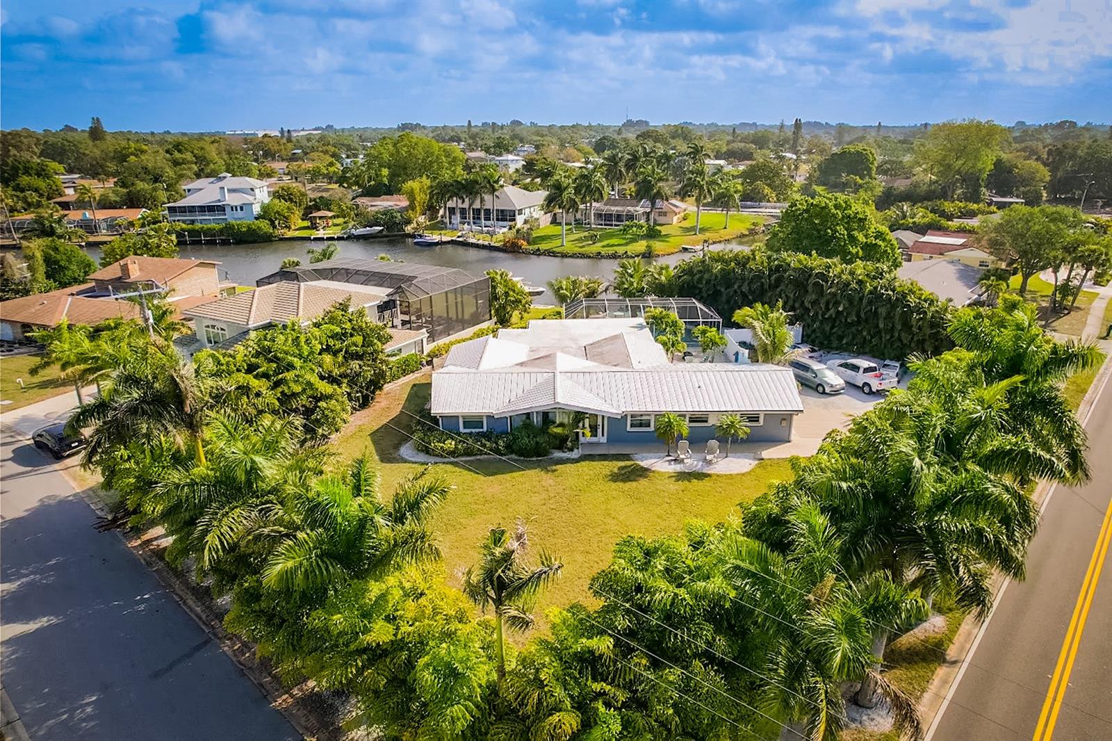 Waterfront Paradise in Sarasota – 2159 Constitution Blvd
Live the ultimate Florida lifestyle at 2159 Constitution Blvd, Sarasota, FL 34231. This beautifully maintained 3-bedroom, 3-bathroom waterfront home offers 2,752 square feet of spacious, updated living on nearly half an acre—just 1.5 miles from world-renowned Siesta Key.
Positioned on a deep saltwater canal with direct Gulf access, this boater’s dream includes a 31x21 concrete dock with 60-amp electric service, water hookup, a 10,000-lb boat lift—perfect for your next adventure on the water.
Inside, the home features natural stone floors throughout, soaring cathedral ceilings, and a split-bedroom layout for added privacy. All bedrooms are generously sized with en-suite bathrooms and ample closet space. The open-concept kitchen is outfitted with modern appliances and opens to bright, welcoming living and dining areas—ideal for everyday comfort and entertaining alike.
Step out to the screened-in lanai and enjoy the newly redone, heated saltwater pool—a sparkling retreat surrounded by tropical landscaping and swaying palms. The covered lanai includes a built-in bar fridge, creating the perfect space to relax or host guests poolside. The backyard is private and peaceful, enclosed with new PVC fencing.
Additional highlights include:
Metal roof
Two AC units (one replaced in 2019)
Two electric tankless water heaters (2021)
400-amp electrical service
No HOA or deed restrictions
Whether you're a boating enthusiast, a host at heart, or simply looking for your own private oasis, 2159 Constitution Blvd offers a rare blend of comfort, freedom, and waterfront luxury in the heart of Sarasota.
Schedule your private tour today!