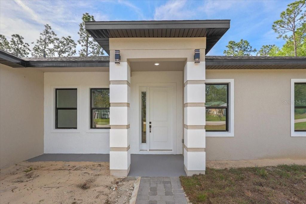 Photo of 8677 N Circular Way, Citrus Springs, FL 34434 (MLS # O6399298)