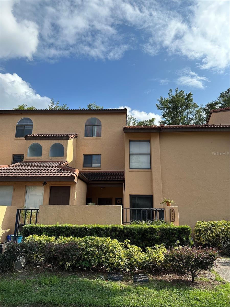 Cleanest condo in the community! Beautiful 2/2 with open floor plan and vinyl (hardwood look) flooring throughout. Granite countertops, split bedrooms each with their own full bathroom. Washer/Dryer included in the inside laundry. Upgraded windows tilt-in for easy cleaning. Back patio overlooks conservation. Community pool and convenient to restaurants, shopping, attractions and everything else Orlando has to offer! Good luck finding anything this nice at this price! Hurry!