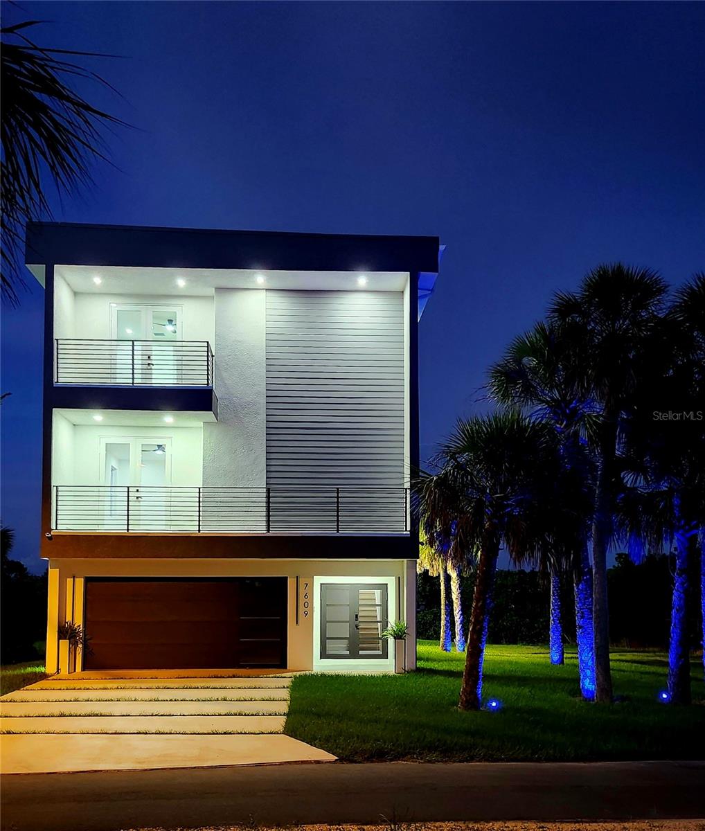 Discover your dream home with access to the gorgeous Gulf of America! The luxury three-story lake townhome awaits you! New construction house, completed - 2025. This stunning 2,900 SqFt offers the perfect blend of luxury and coastal living. Nestled along a serene canal, enjoy fishing or bring your shallow boat or kayaks, whether you are a boating enthusiast or seeking a tranquil coastal escape. The house features a modern, sleek style with clean lines, tall ceilings with an open-concept layout combining a spacious living room, dining area and gourmet kitchen. The inviting kitchen boasts plenty of cabinetry, has high-end finishes like quartz countertops, GE Cafe induction cook top and new appliances, a modern wall mount pot filler facet, all while you are enjoying the view of nature through out the French doors that connects to the balcony, either you choose the sunset view or the back of the house that overlooks the lake. The third floor includes a primary suite with a walk-in closet and luxurious en-suite bathroom with double sink. The second bedroom is similar than the primary suite with a spacious walk-in closet, as well. The house has a central vacuum, for your convenience and a double insulated garage door with a four tandem garage with an additional storage room. Imagine working in some projects in your garage with A/C, can't be better than this! Enjoy your Florida summer soaking into the salt water pool that has fire pit waterfall to entertained. Additional to the gorgeous house, you have the fabulous opportunity to own an extra lot! The additional lot is directly connected to the current lot featuring the property. There is a Survey and floor plan ready for you to build a house next door! On the house opposite side there are no side neighbors, this is truly a rare opportunity to own this much water view real estate. This lot also provides you with plenty of space for your boat, kayaks, RV, you name it! Enjoy the most amazing sunsets from your balcony and start living your dream home!