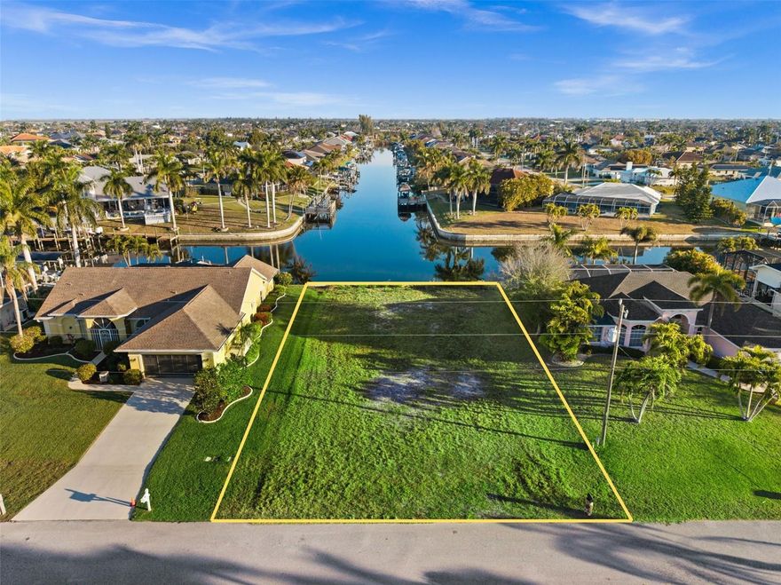RARE INTERSECTING CANAL GULF ACCESS LOT WITH A NEW SEAWALL — READY FOR YOUR DREAM BUILD! Welcome to 2623 SW 35th Ln, a prime build site in one of SW Cape Coral’s most desirable boating neighborhoods, just off Surfside & Oasis, surrounded by beautiful waterfront homes. Enjoy long canal views in multiple directions and the true Southwest Florida lifestyle. Keep your boat in your backyard and cruise the Cape Coral canal system out to the river and Gulf for fishing, island days, and waterfront dining. Big bonus: the hard work is already underway. A seawall was installed in 2023, and the seller has completed a substantial amount of pre-construction planning—including approved plans and permits that have been pulled and paid for (construction has not begun). The seller has invested in architectural/structural plans, surveys, site and drainage plans, energy calculations, and more. Plus paid permit fees and a truss deposit. Build your dream Gulf access home now, or secure a high-demand waterfront lot as an investment for the future. Buyer to verify all building requirements, permit status, and transferability with the City of Cape Coral.