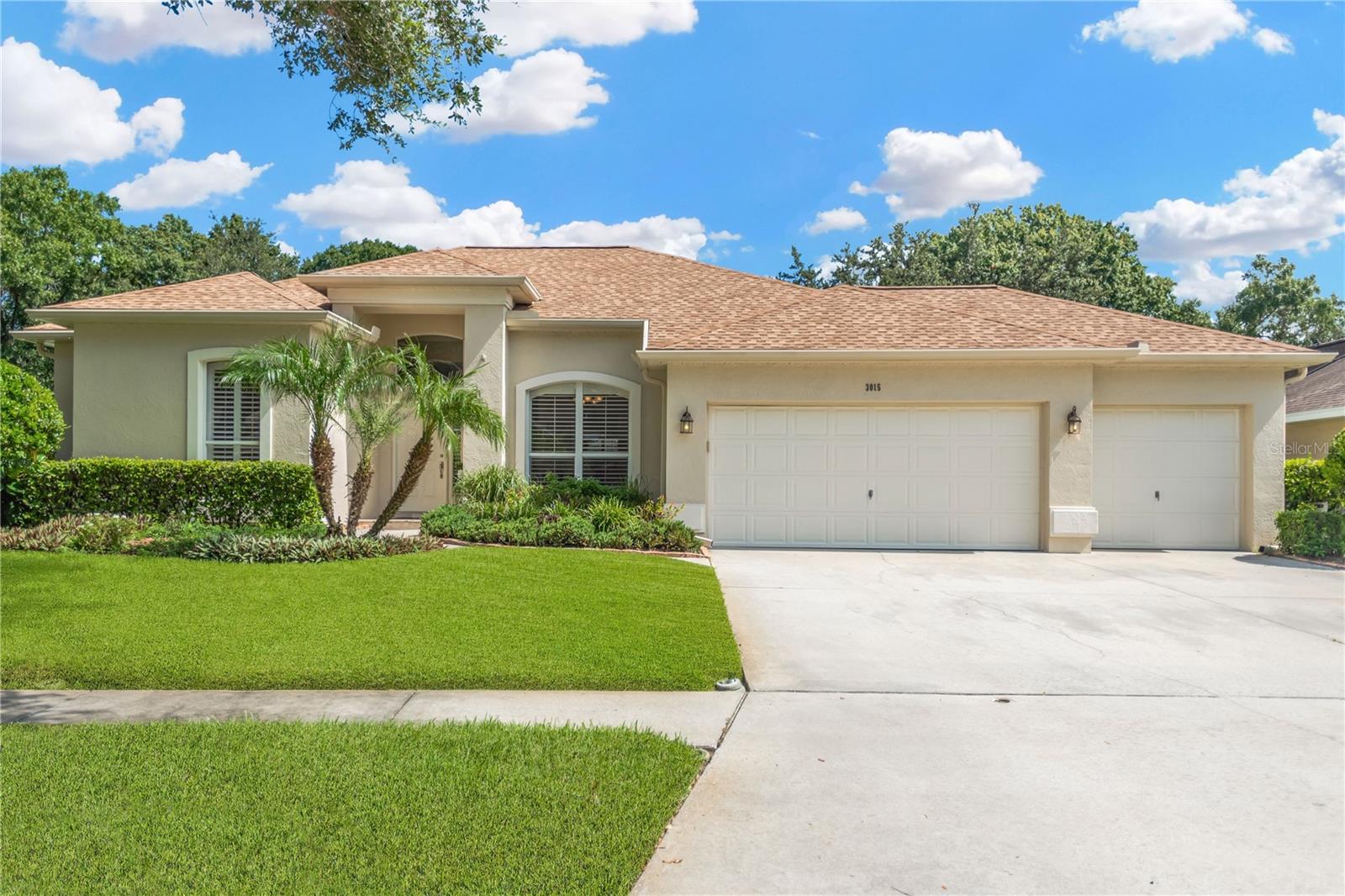 Welcome home! This single-story pool home features an open layout designed for comfort, functionality and lasting livability. Curb appeal shines with freshly trimmed tress, a well-manicured lawn and a travertine tiled front porch. Once inside, you have a clear view of the sparkling pool and lush green yard beyond the double sliding glass doors. The flooring in the entire home is a durable and easily maintained rich wood look tile, creating a seamless flow throughout. No carpet here! The formal dining room and living room are located near the entrance of the home – perfect for entertaining friends or big family gatherings. The master bedroom is also located at the front of the home, tucked away from all the other bedrooms and main living area for ultimate privacy. The ensuite bathroom feels luxurious with upgrades including newer fixtures, a double sink vanity and granite countertops. Spa vibes await as you melt away the stress of a long day in the soaker bathtub. The kitchen includes granite countertops and backsplash, updated wood cabinets with undermount lighting, stainless appliances and a deep built-in pantry. Pull up a stool at the bar top for casual dining in the kitchen or enjoy a light meal in the breakfast nook. Sliders from the master, living, and family room offer stunning pool views and all open to the screened lanai, perfect for indoor-outdoor living. The solar heated pool is surrounded by travertine decking with plenty extra space for both alfresco dining and pool side sunbathing. If the great outdoors is your ideal spot, this home offers a huge backyard - over a quarter acre. The fully fenced backyard has room to roam, play or garden; banana, citrus and avocado trees included! Invite your neighbor over for a guacamole party. This exceptional home is nestled in Twin Lakes, a peaceful and well-established neighborhood with no CDD, a low HOA and top-tier amenities. Residents enjoy an 11-acre park with playground, resort-style pool, tennis and basketball courts. The scenic walking path around Lake Michaela is in the center of it all! Home to an impressive array of wildlife, the morning and evening walks around the lake are legendary. The park hosts a full calendar of neighborhood events like Easter egg hunts, holiday concerts and craft fairs. Food Trucks make bi-weekly visits too, adding to the fun. Twin Lakes is just minutes to shopping, dining, and major routes for a smooth commute to Tampa. Welcome home!