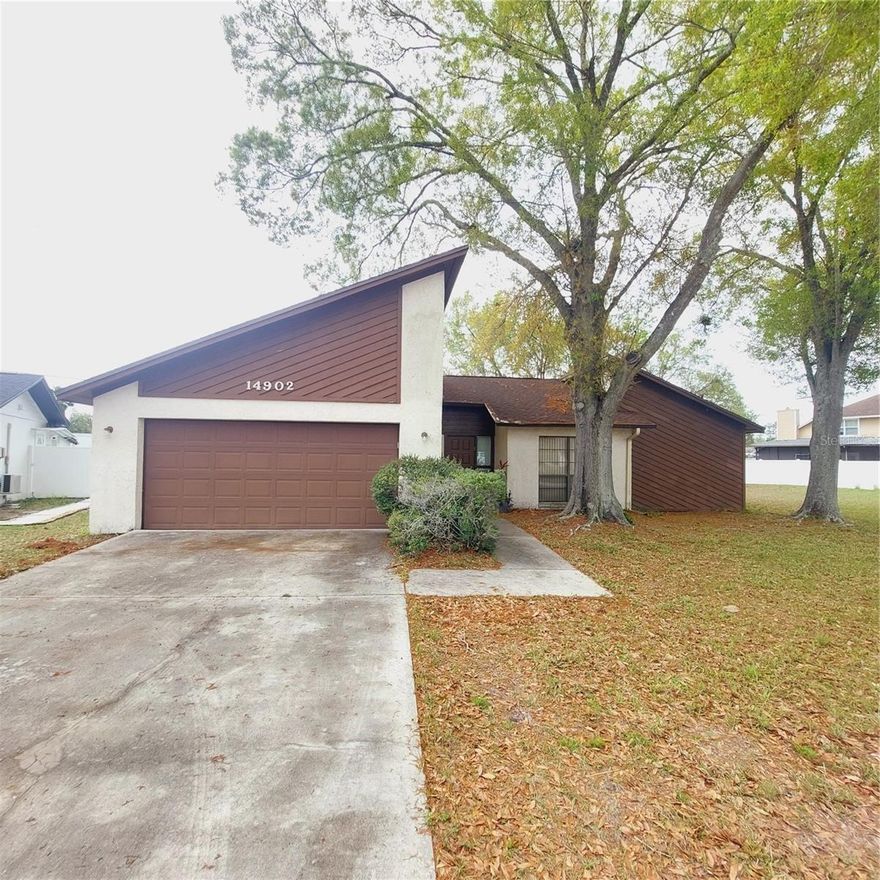 Welcome to this charming single-family home located in the desirable Carrollwood area of Tampa. Situated on a spacious 0.28-acre lot, this well-maintained residence offers 3 bedrooms, 2 bathrooms, and approximately 1,527 square feet of living space, plus a 378 sq ft two-car garage. Built in 1983, the home features a functional layout with generous living areas and plenty of natural light throughout.

The inviting floor plan includes a comfortable living room with a fireplace, a separate dining area, and a well-appointed kitchen—perfect for everyday living and entertaining. The primary suite provides a private retreat with an en-suite bathroom and walk-in closet, while two additional bedrooms offer flexibility for family, guests, or a home office.

Step outside to enjoy the oversized backyard with plenty of room for outdoor activities, gardening, or future additions such as a pool or expanded patio. The nearly quarter-acre lot provides both privacy and space rarely found in nearby neighborhoods.

Conveniently located near major roadways, shopping, dining, parks, and schools, this home combines peaceful neighborhood living with easy access to everything Tampa has to offer. Whether you're looking for your first home, a growing family residence, or an investment opportunity, this property is full of potential.