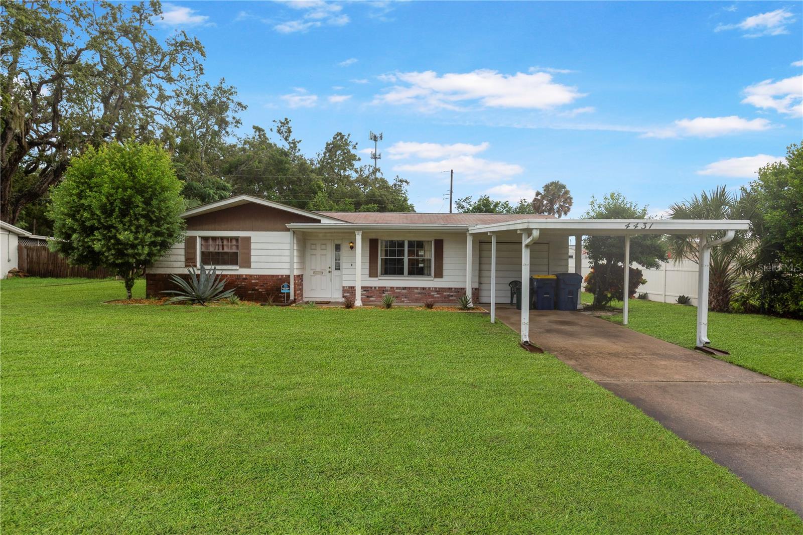 Great starter home for first time homebuyers or investors! Right off of U.S 19, this house sits on a big lot with huge and well taken care of back yard with convenient workshop/storage shed. This 2 bedroom 1 bathroom and 1 car garage home has a Livingroom, kitchen with nook and family room. Fully screened in Florida/lanai room. AC was changed in 2017, updated electrical panel, Septic is 4 years old and was just serviced June, 2025. Great benefit of not having HOA or CDD and no flood insurance required, giving you the freedom to enjoy your space without any restrictions. Conveniently located just minutes from local shopping, restaurants, and outdoor attractions like Anclote River Park. Don't miss out on this opportunity and schedule your showing today!