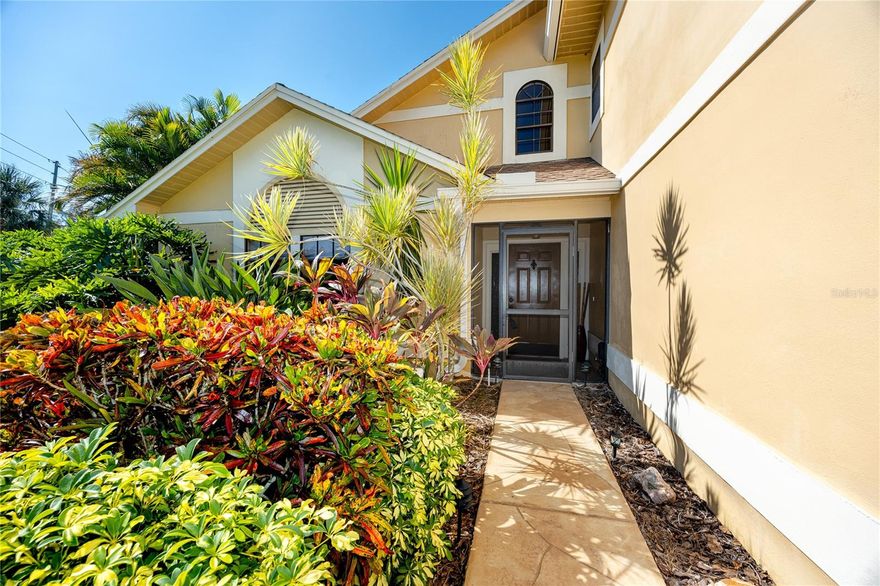 This stunning 3-bedroom, 3-bath pool home in Tarpon Springs sits proudly on an oversized corner lot, surrounded by mature landscaping and designed for both comfort and peace of mind. Meticulously maintained and thoughtfully updated, the home combines timeless style with practical upgrades, making it a rare move-in-ready find with no HOA restrictions.

Step inside to soaring vaulted ceilings, rich wood flooring, 20-inch neutral ceramic tile, and an abundance of natural light. The flexible floor plan includes a spacious 18x26’ living room and formal dining area, while the inviting family room centers around a beautiful brick wood-burning fireplace. The kitchen is a chef’s delight, featuring swirled granite countertops, a pull-up island, wood cabinetry, a tray ceiling, closet pantry, breakfast bar with pendant lighting, and a dinette space—perfect for everyday meals or entertaining. Nearly all main-floor windows overlook the pool, keeping the home bright and connected to the outdoors.

Upstairs, the expansive primary suite is a private retreat with a massive custom walk-in closet complete with California-style shelving and cedar parquet flooring. The spa-like ensuite bath offers a luminous walk-in shower with seating, his-and-her sinks, an upgraded Toto commode, and abundant cabinetry. Two additional bedrooms each include oversized vented walk-in closets, ensuring exceptional storage throughout.

This home has been enhanced with countless extras that elevate everyday living such as a central vacuum system, epoxy-finished garage floors with generous storage, newer lighting and remote-controlled ceiling fans, and updated blinds and shades throughout. For added peace of mind, it features a whole-home reverse osmosis system, and newer solar panels that power the entire home.
Outdoor living is equally impressive. The screened pool area includes paver decking, a sparkling pool, and a covered seating area that together create a true tropical oasis. A separate wood-decked space under roof is ideally suited for a future hot tub. The fully fenced yard ensures privacy and plenty of room to enjoy the Florida lifestyle year-round.

Located just minutes from Sunset Beach, Fred Howard Park, the historic Sponge Docks, marinas, and downtown Tarpon Springs, this home offers the perfect blend of tranquility and convenience. Zoned to top-rated schools and surrounded by local charm, it’s an ideal setting for both everyday living and memorable gatherings.

Beautifully maintained, upgraded with high-quality features, and free of HOA restrictions, this Tarpon Springs home truly has it all. Schedule your private showing today and experience the perfect balance of peace of mind and Florida living.