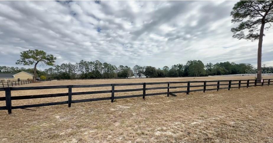 Build your dream home on this 1.52-acre lot in Silver Meadows North, a gated Silver Springs / NE Ocala community with tennis, racquetball and basketball courts. Conveniently located near shopping, dining, and just 18 miles to the World Equestrian Center in Ocala. Enjoy easy access to Orlando, Tampa, and beautiful beaches.