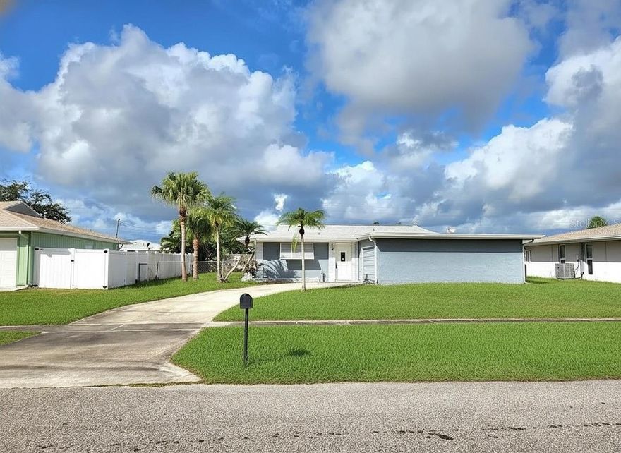 One or more photo(s) has been virtually staged. Cute, well-maintained home featuring brand-new stainless steel appliances, a new roof (2023), new A/C (2024), and a new hot water heater. The interior has been freshly painted throughout, including the kitchen cabinets.

The spacious one-car garage offers plenty of storage, while the fully fenced yard includes a generous storage shed. A gated entrance allows for boat, jet ski, or outdoor vehicle storage.

Off the living room is an enclosed bonus room with window A/C, leading to a screened-in lanai—perfect for relaxing or entertaining. Terrazzo floors throughout keep the home cool, durable, and smooth.

Located in a waterfront community, the public boat launch at Marina Park is just 3 minutes away. Conveniently close to a playground, Anna Maria Oyster Bar, and a variety of shopping and dining options.

The beach is about 25 minutes and the Water Park 10 min. away with annual passes available that are affordable.