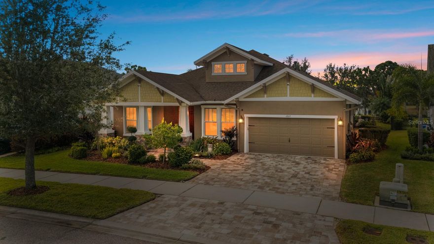 Located in the highly sought-after Waterset community, this beautifully maintained home offers bright, open living spaces enhanced by soaring 12-foot ceilings and a thoughtfully designed three-way split floor plan that provides both privacy and flow. Set on an upgraded premium lot with tranquil pond view in rear and no neighbors directly across the street, plus a 3 car garage, the home enjoys a rare sense of openness and exclusivity unmatched by others currently available. A sun-filled private office and bonus room provide ideal flex space for working from home, a playroom, or a media retreat. Step outside to the screened-in pool and covered patio—perfect for entertaining or unwinding on warm Florida afternoons. The primary suite is a true sanctuary, featuring a spa-like in-ground soaking tub and an oversized walk-in shower. The chef’s kitchen is appointed with full appliances, a gas range, a large island for gathering, and a spacious walk-in pantry for ample storage. A custom laundry room with sink adds everyday convenience, while the extra-large garage accommodates two vehicles, generous storage, and a versatile windowed area ideal for hobbies or a workshop. Residents enjoy resort-style amenities including a lap pool, expansive wraparound pool with waterslide, multiple playgrounds, a full sports complex with football, basketball, volleyball, and tennis courts, and a clubhouse for community events.
An exceptional home on an exceptional lot—offering elevated design, privacy, and the very best of Florida living.