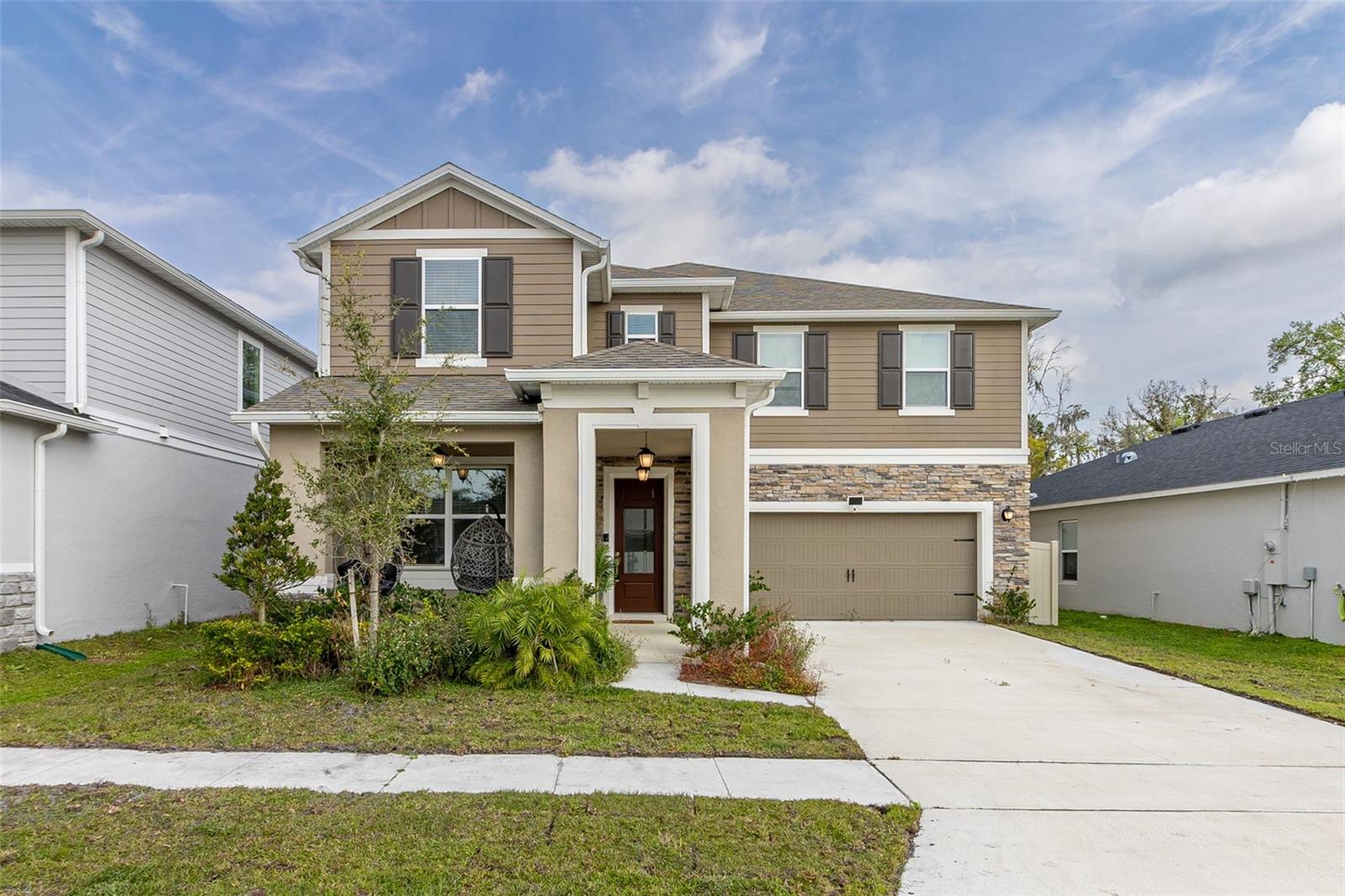 Welcome to a one-of-a-kind, Beautiful Tivoli Community. This spacious house for rent is located in the desirable area in Davenport, offering a great combination of comfort, convenience, and accessibility. This Luxurious FULLY FURNISHED two-story house features 5 spacious bedrooms, 4.5 bathrooms, plus LOFT and a 2-car garage making it ideal for families or professionals looking for a comfortable and spacious living environment. As you step inside, you'll be greeted by an open space living area, with plenty of natural light streaming in through large windows. The well laid out kitchen space offers 42” wood cabinets quartz countertops, island, separate pantry closet. The kitchen is fully equipped with all appliances you need to whip up delicious meals, and there is ample counter space and storage for your cooking needs. Second floor featuring primary bedroom suit and 4 additional bedrooms and bathrooms with modern and elegant fixtures and finishes. Spacious primary bedroom and bathroom with dual sinks, walk-in shower, garden tub, and custom walk-in closet. Four additional bedrooms for family/guests. Every room is furnished and decorated with top notch interior designer. Outside, you'll find a lush, gorgeous backyard with covered lanai that's perfect for relaxing and entertaining. There's plenty of room for everyone to play and a large lanai that's ideal for barbecues and outdoor dining. Contact us today to schedule a tour!